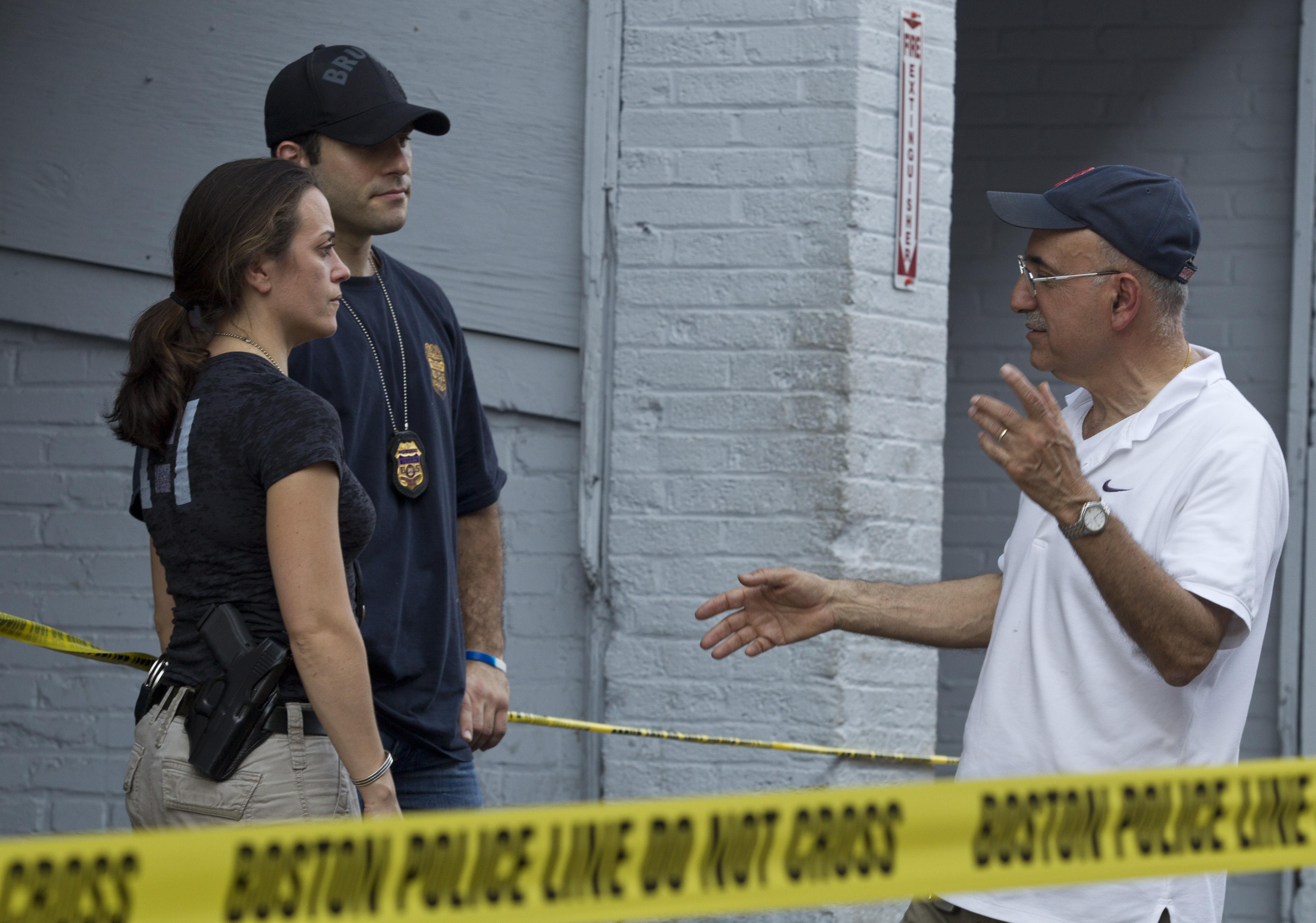 Boston Cab owner Edward J. Tutunjian talked with federal agents during Friday’s raid at his company’s Fenway garage.