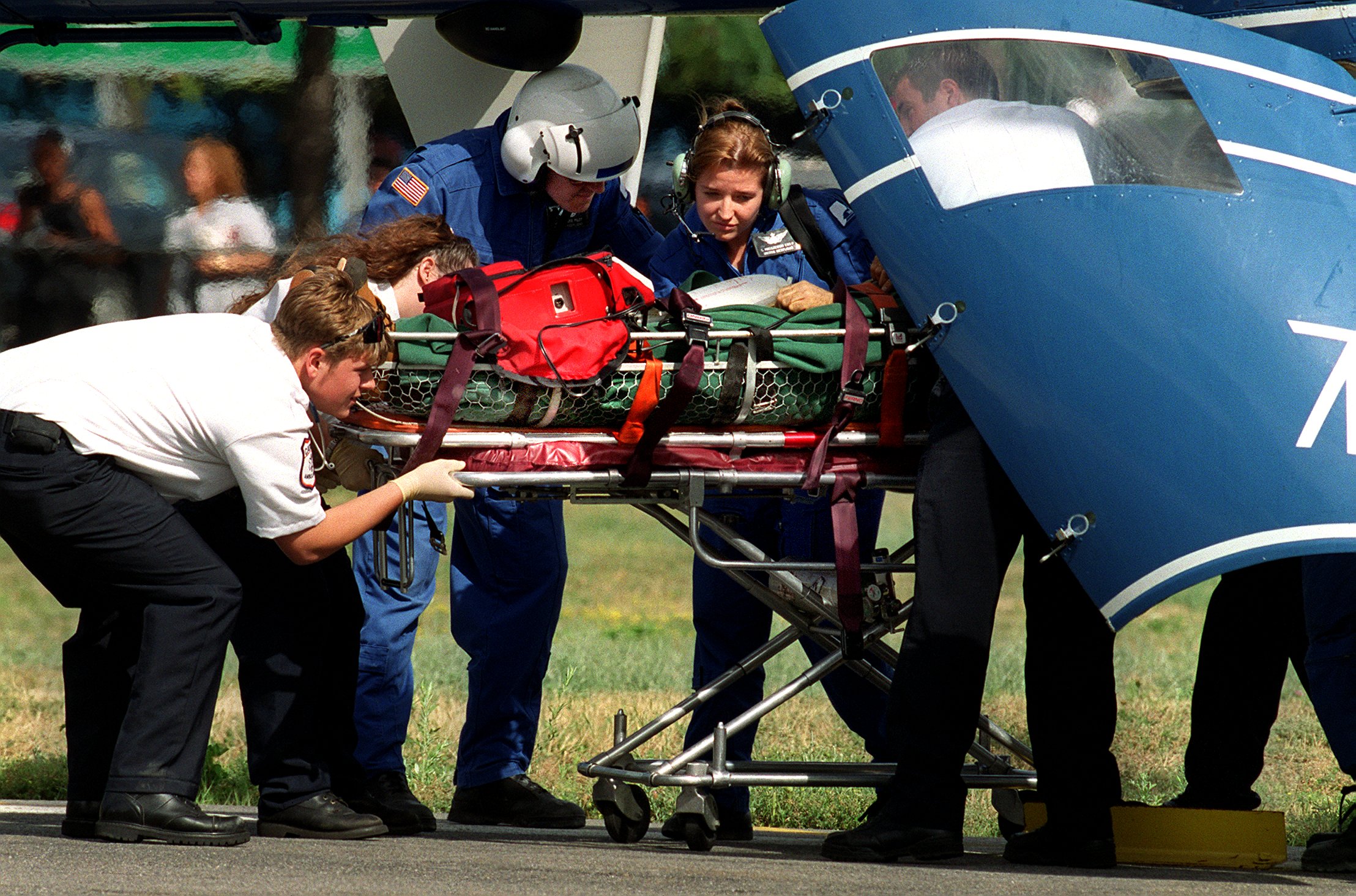 One of the stricken divers is transported to Boston Medical Center.