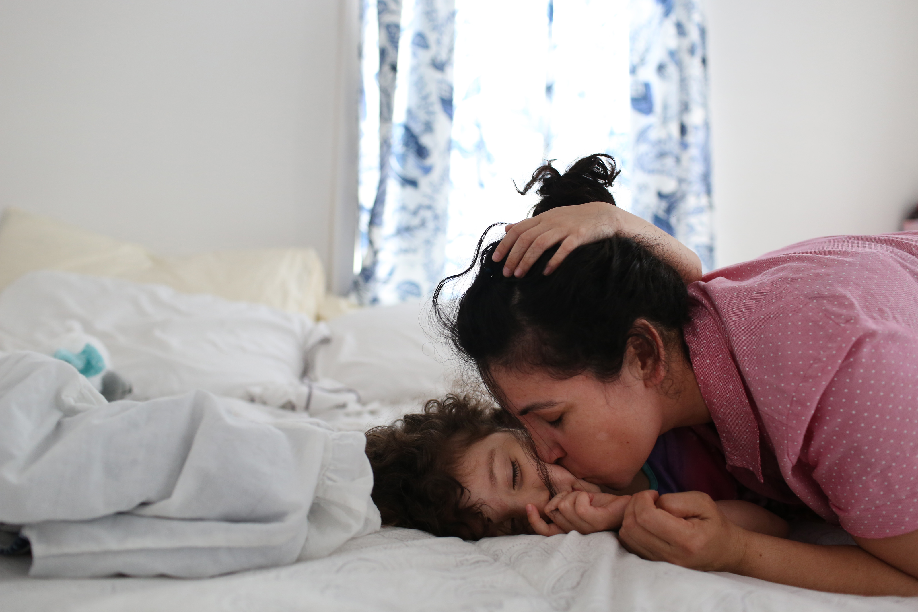 Patricia kissed Camila as she lay in the bed they share in their rented apartment. “Mami, I want to snuggle with you,” Camila said almost in a whisper.