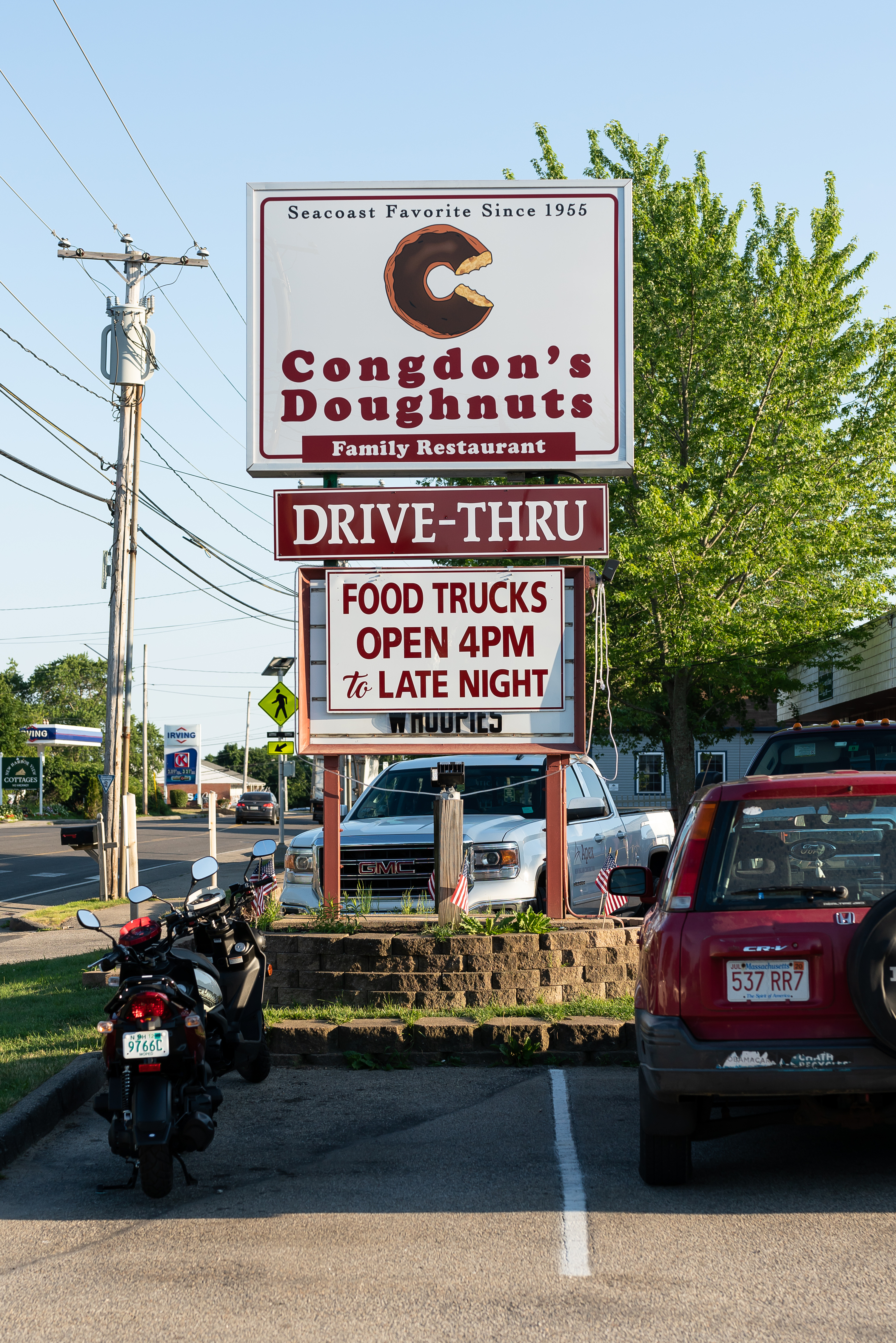 A sign for Congdon's Doughnuts and the food truck park.