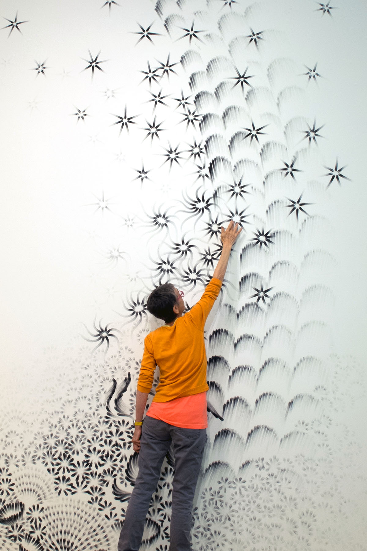 New York artist Judith Braun creates her ArtPrize entry on the walls of the Grand Rapids Art Museum in “More Art Upstairs.”