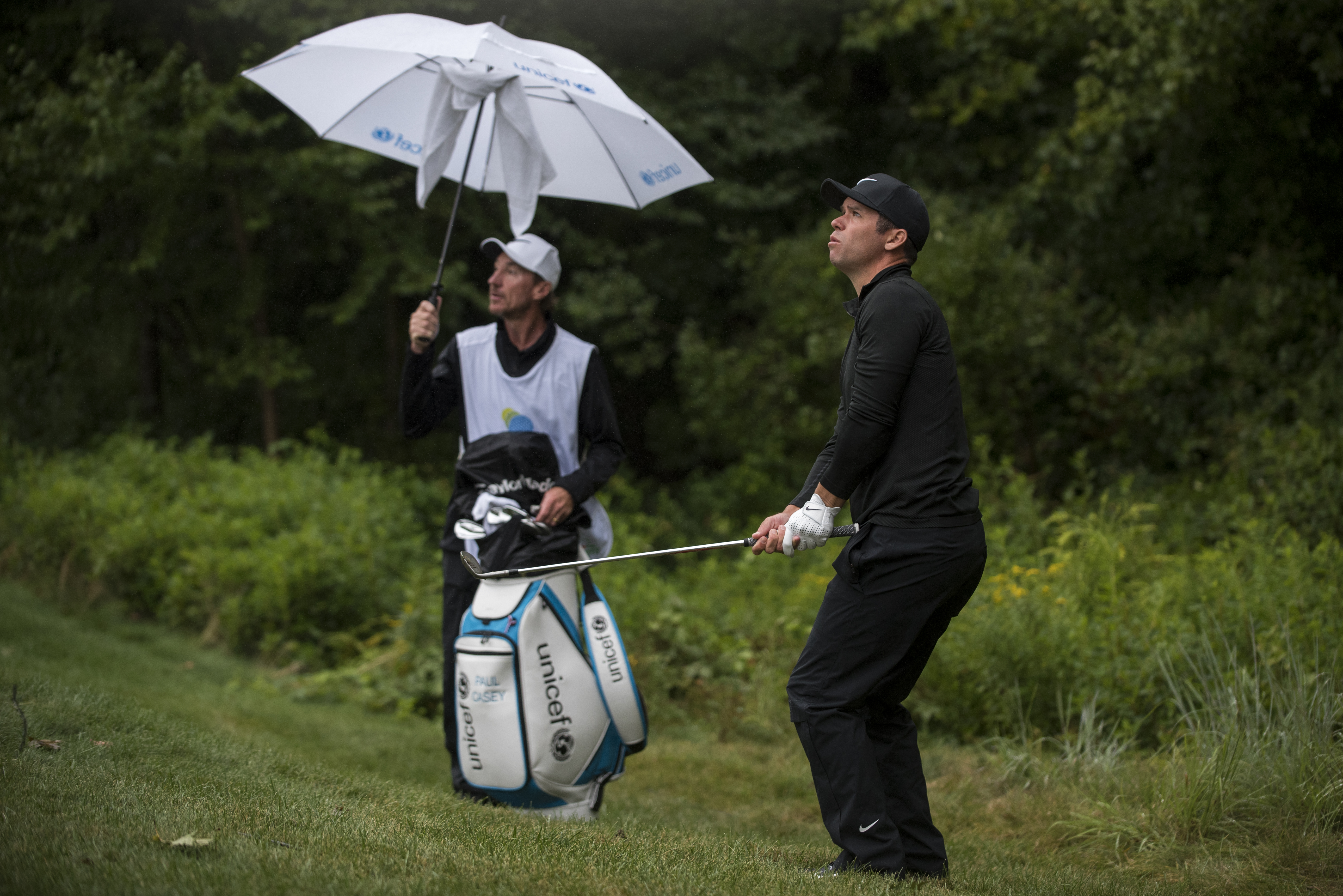 Paul Casey, a little out of position on the fifth hole, is just one shot back.