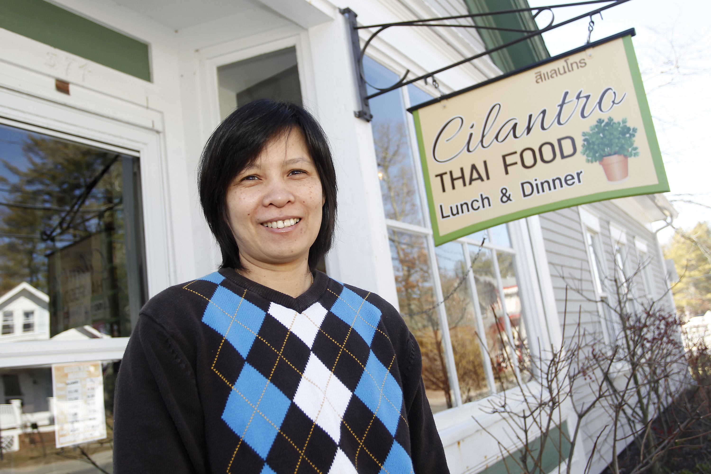 Padee Phimolmas outside her restaurant, Cilantro Thai Cuisine, in Marion. (Stew Milne for The Globe)