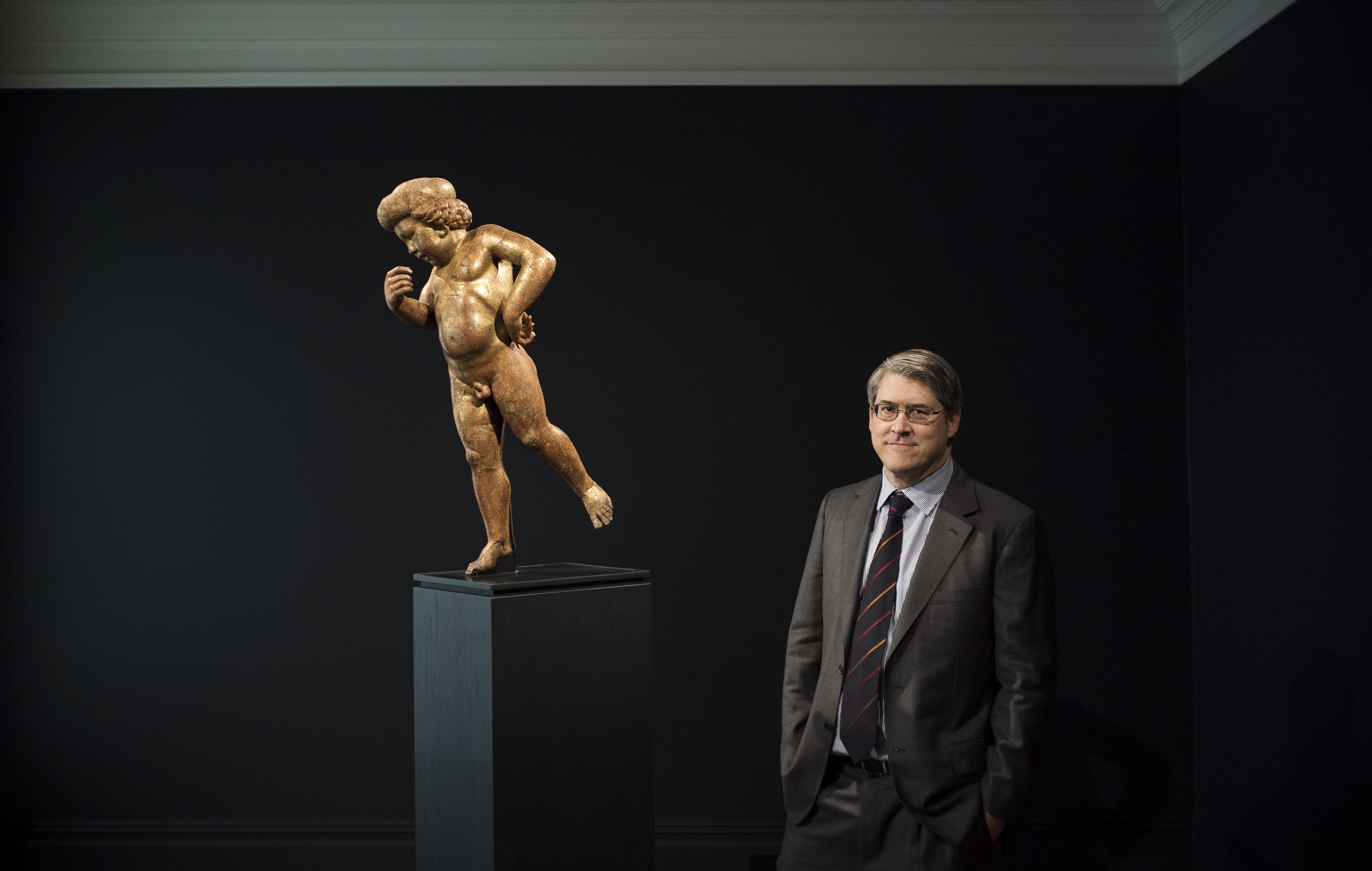 Renaissance scholar Andrew Butterfield with a wooden, gilded cherub that he and several other experts believe is a lost work by Donatello.