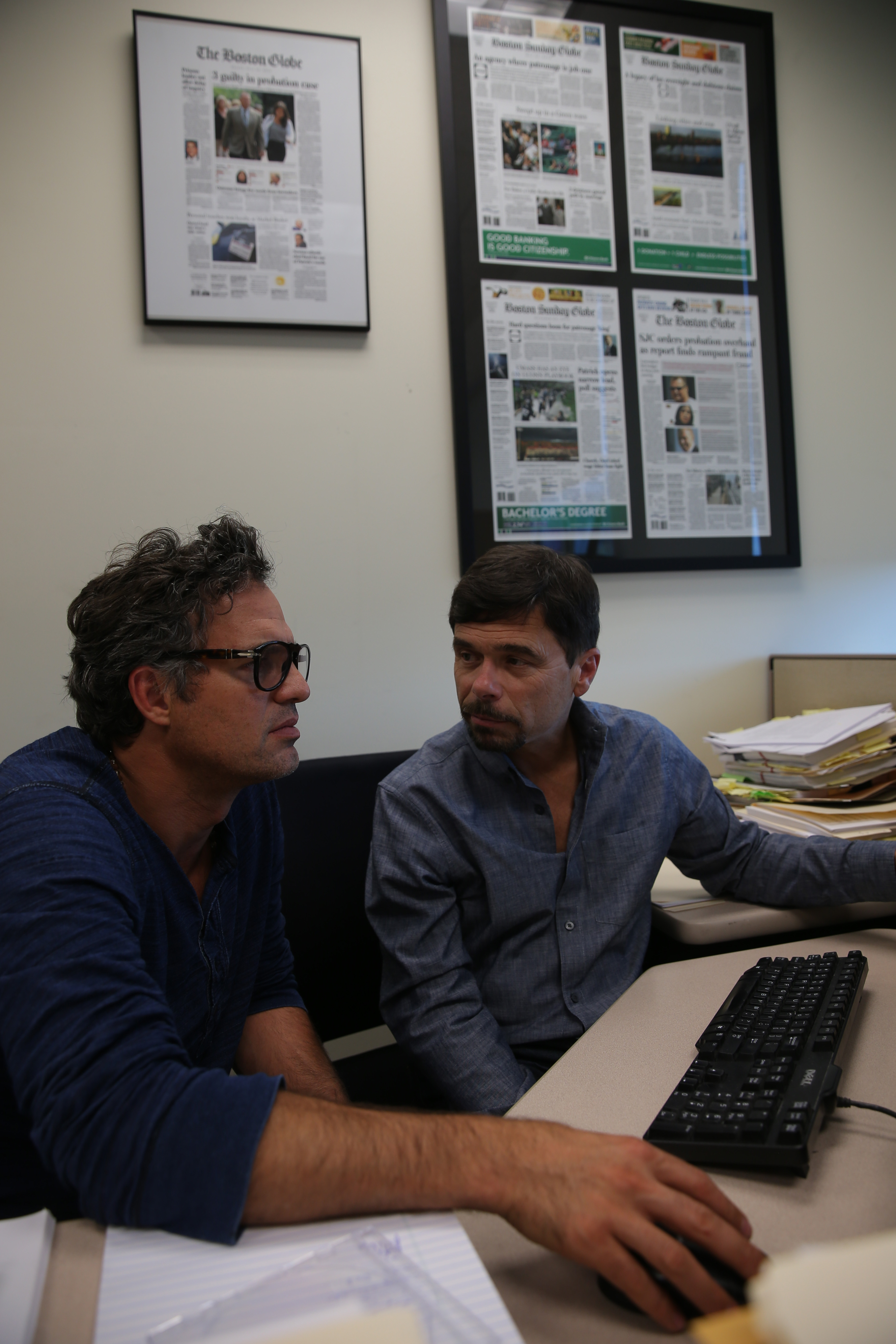 Mark Ruffalo (far left) and Michael Rezendes in the Globe newsroom.
