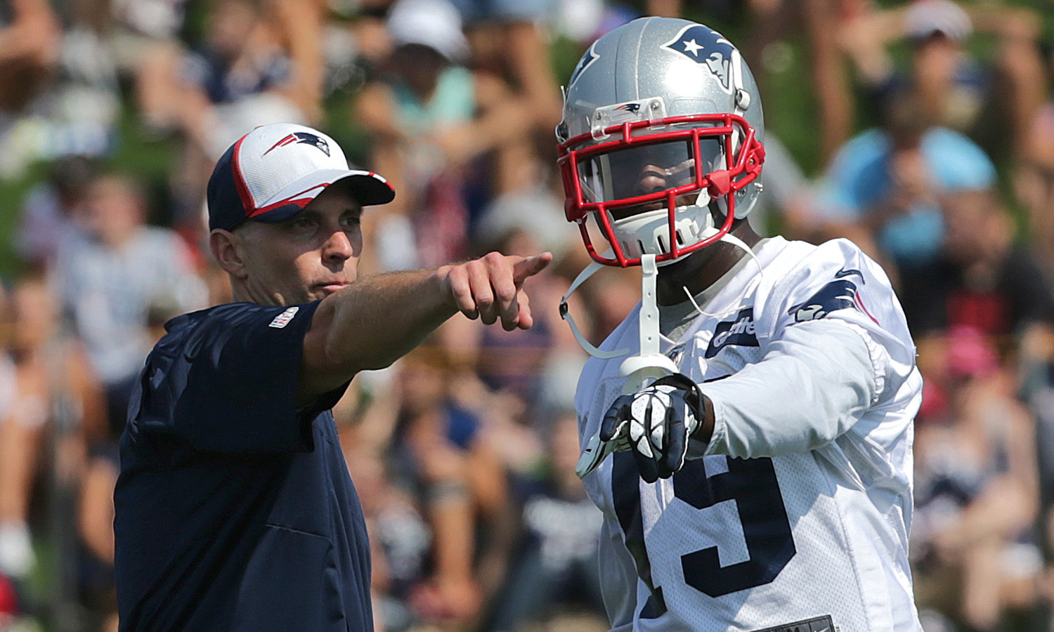 Chad O'Shea, the Patriots’ wide receivers coach, is seen working with Brandon LaFell last summer.
