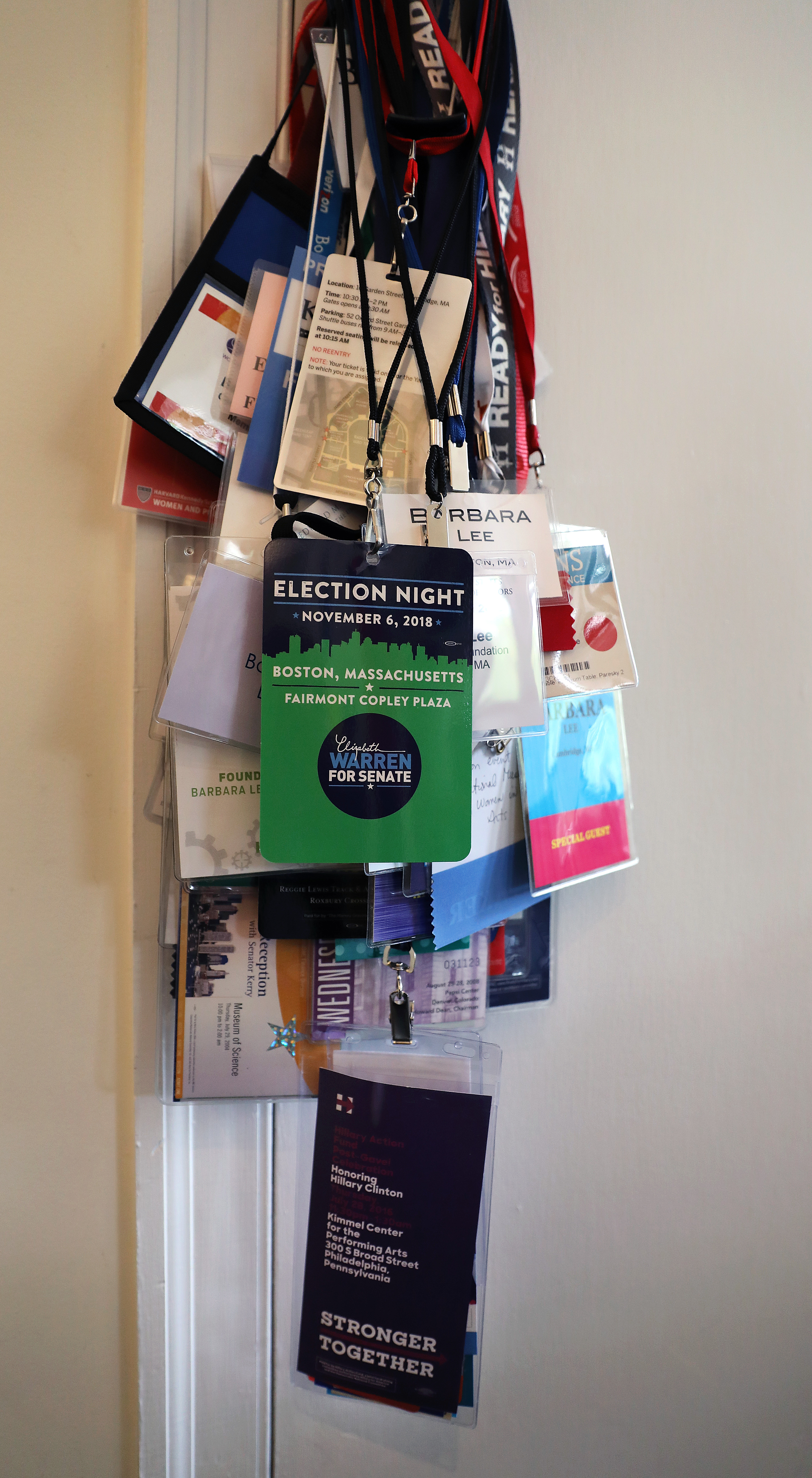 A closet doorknob draped with lanyards from various campaign events Lee has attended.