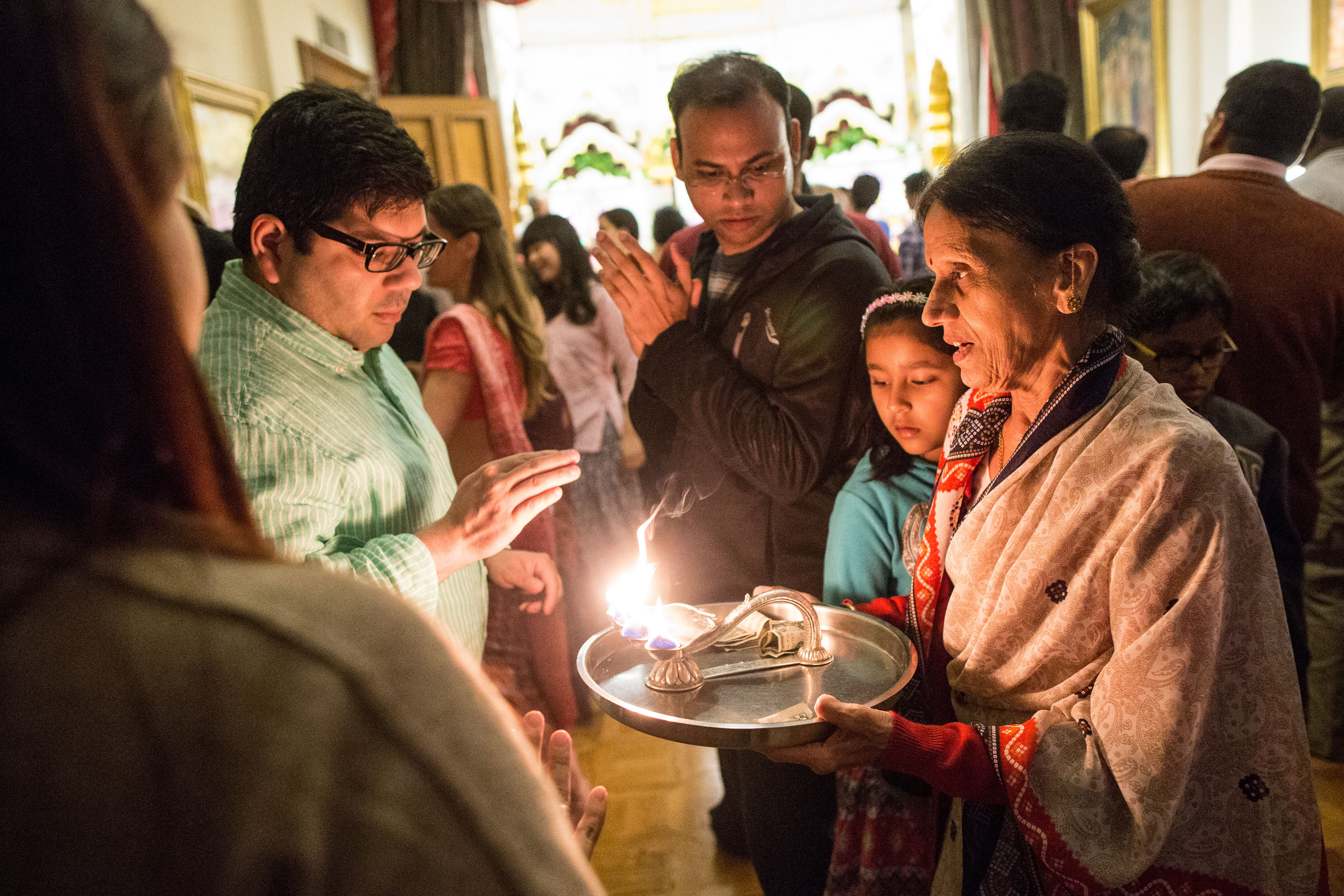 Devotees prayed during a service at Iskcon Temple in Back Bay on Sunday.