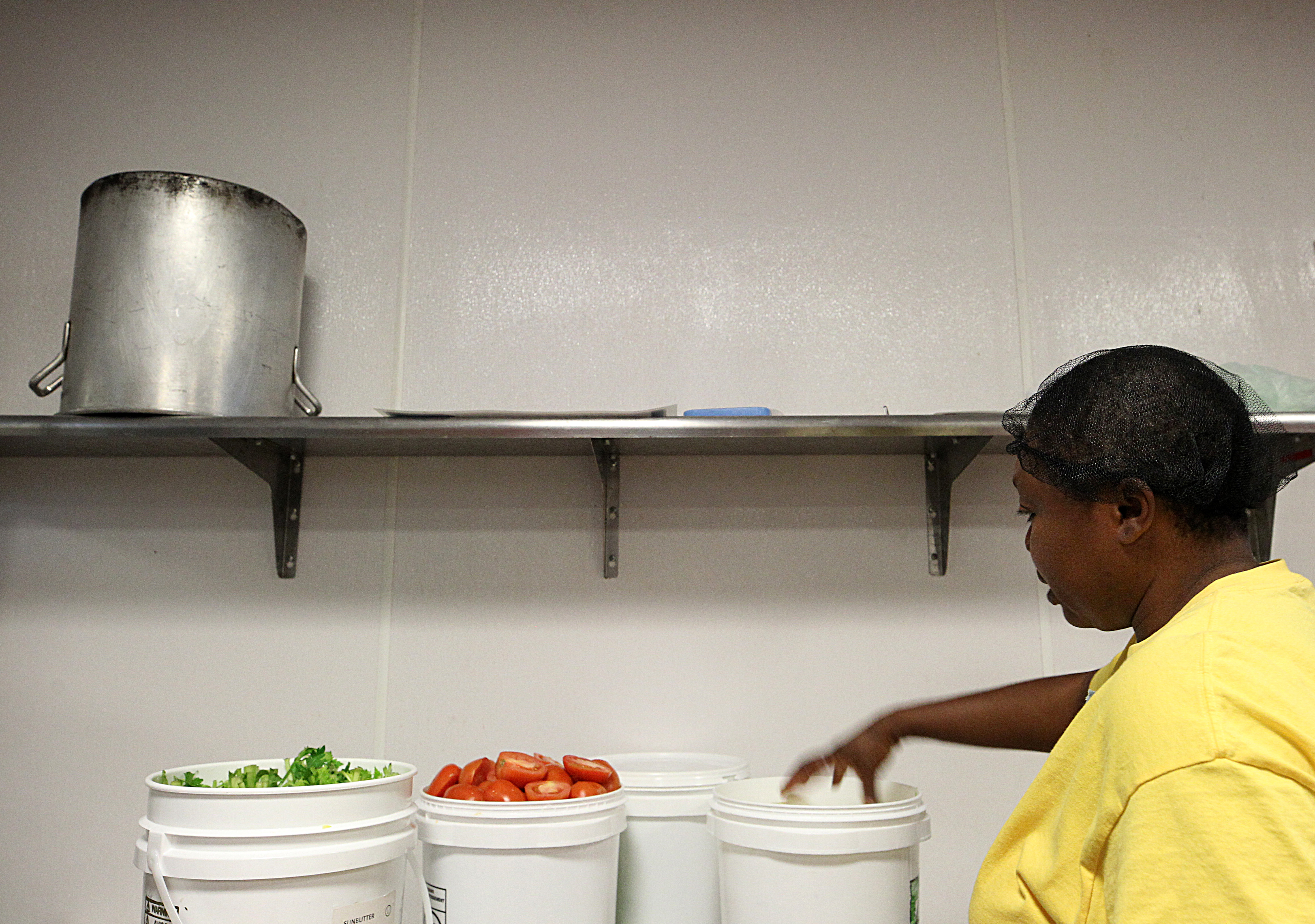 Paulette Ngachoko handles the ingredients for her sauce.