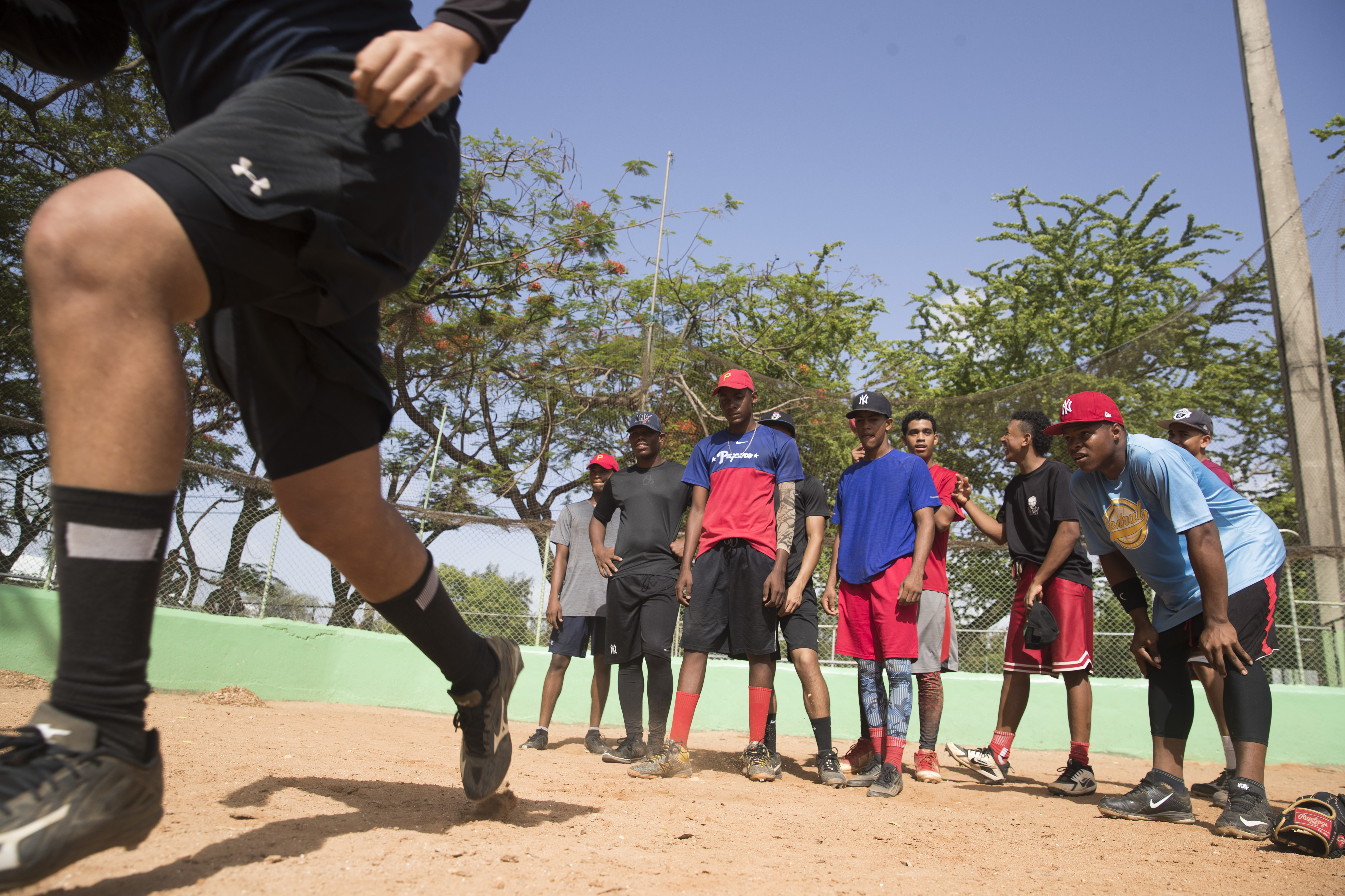 Boys aspiring to land Major League Baseball contracts train on a field David Ortiz has frequented at the Olympic Center in Santo Domingo.