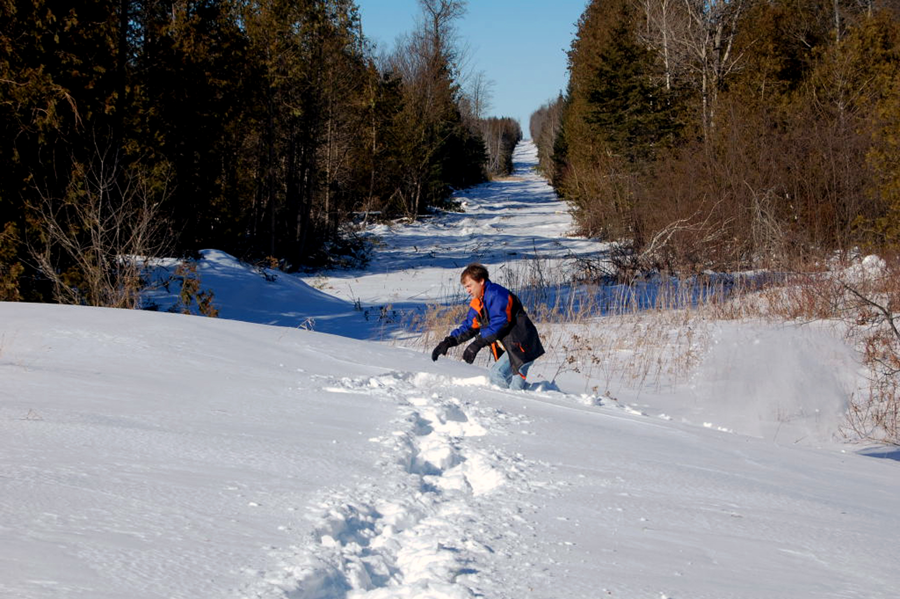 Kevin Haskew, a field engineer with the International Boundary Commission, dug out a boundary marker in the town of Hodgdon, Maine.