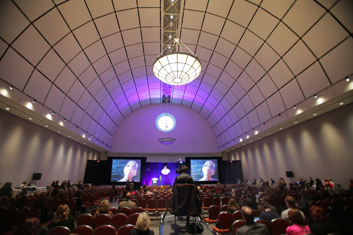 Convention-goers watched a presentation sponsored by the New Orleans tourism bureau in a ballroom at the Hynes.