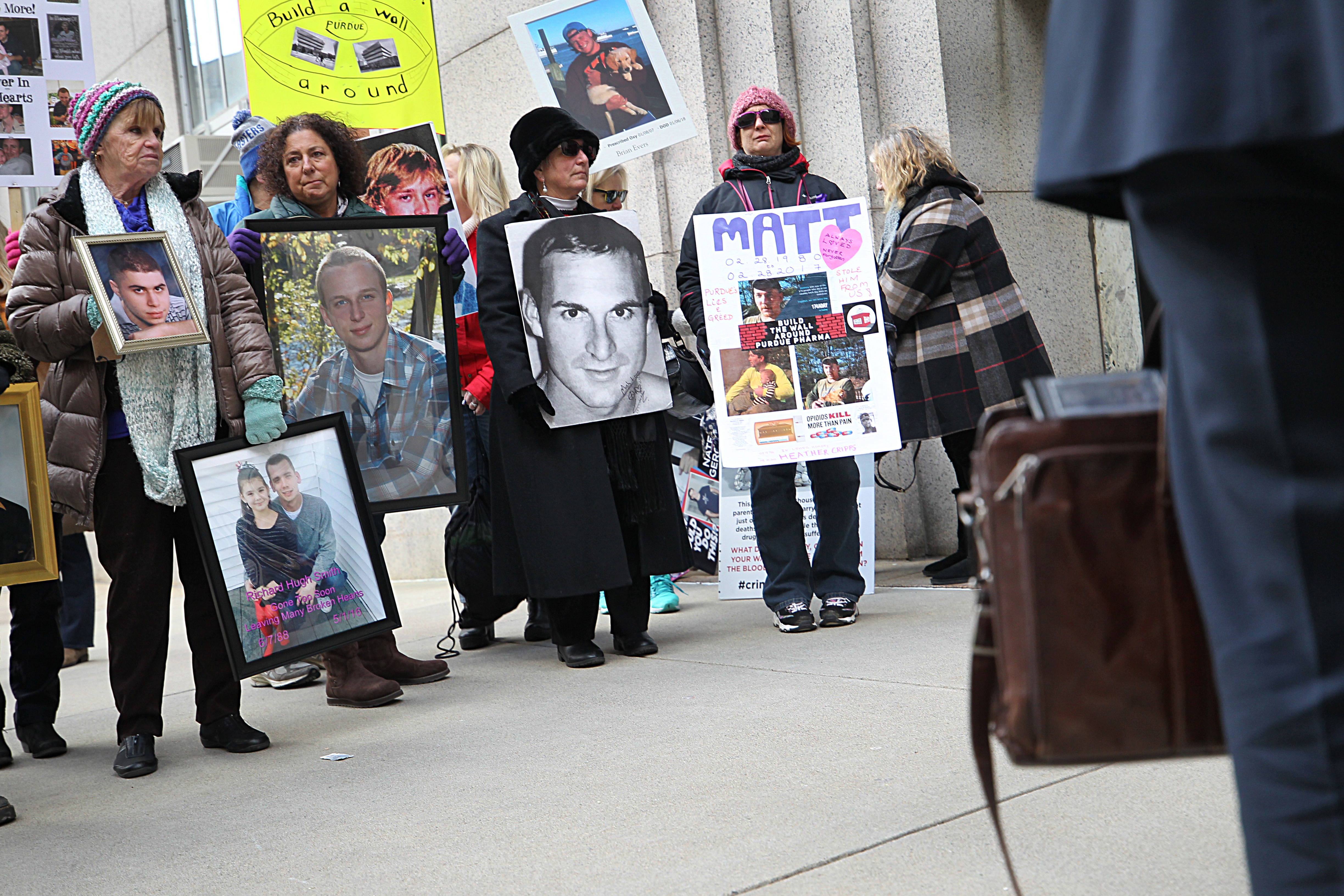 Families who lost loved ones to the opiod crisis, protested in front of Suffolk Superior Court.