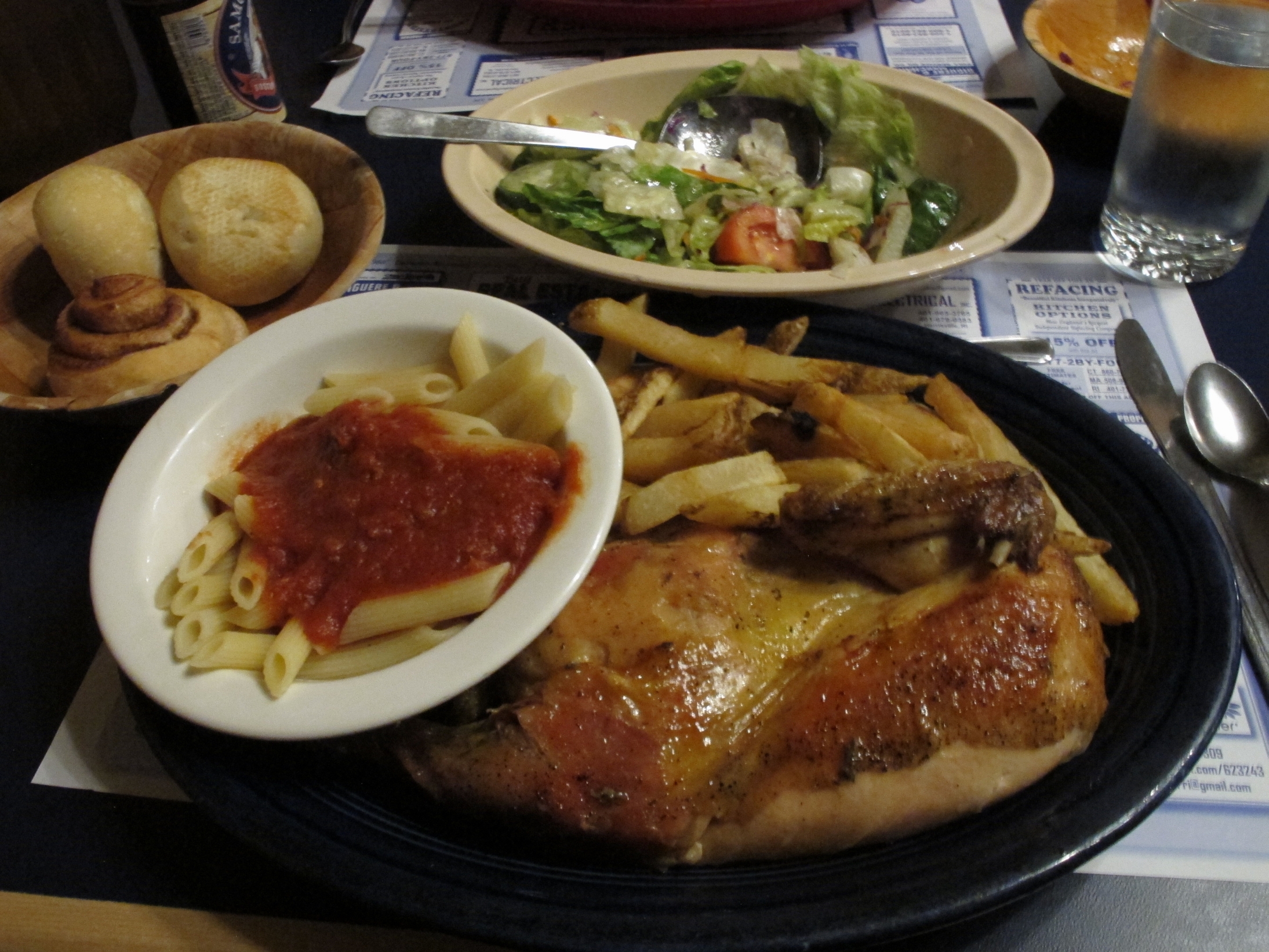 Village Haven serves its family-style chicken with fries, penne with red sauce, rolls, and salad (and an ice cream dessert).