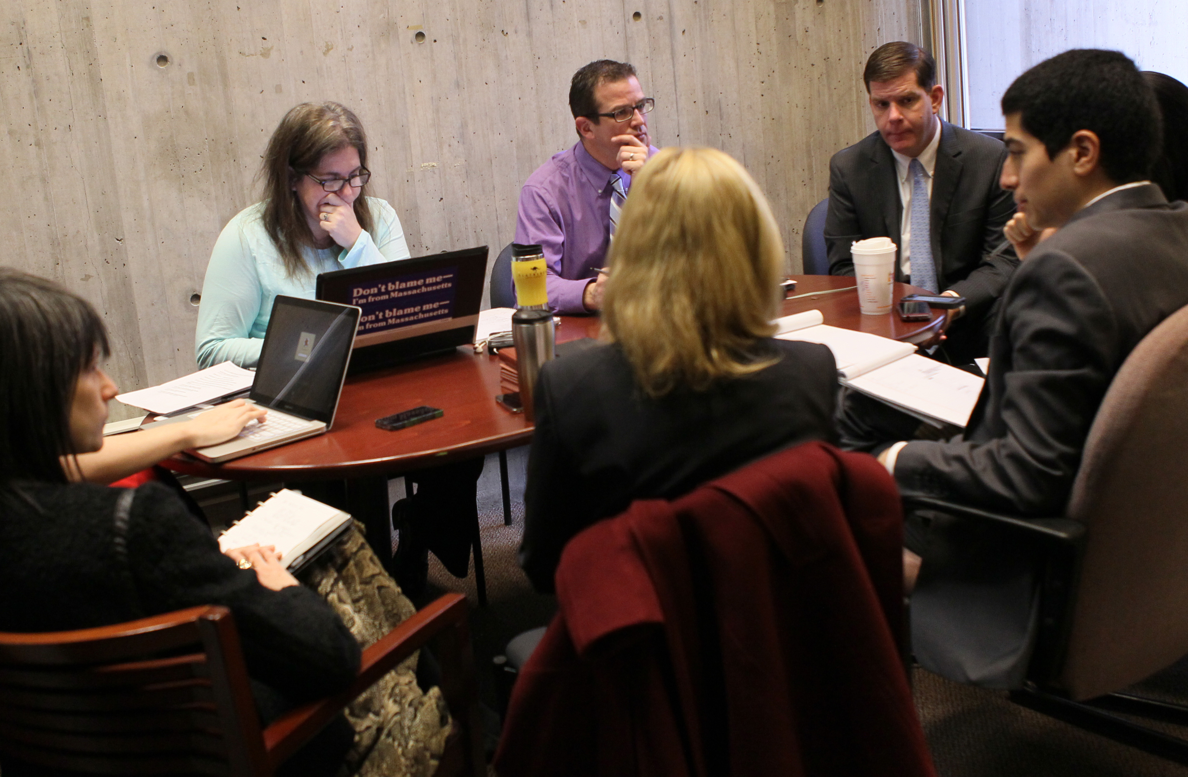Mayor Martin Walsh’s first wave of hires at City Hall include Joyce Linehan (second from left), Joseph Rull (seated next to Linehan), and Daniel Arrigg Koh (profile, right).