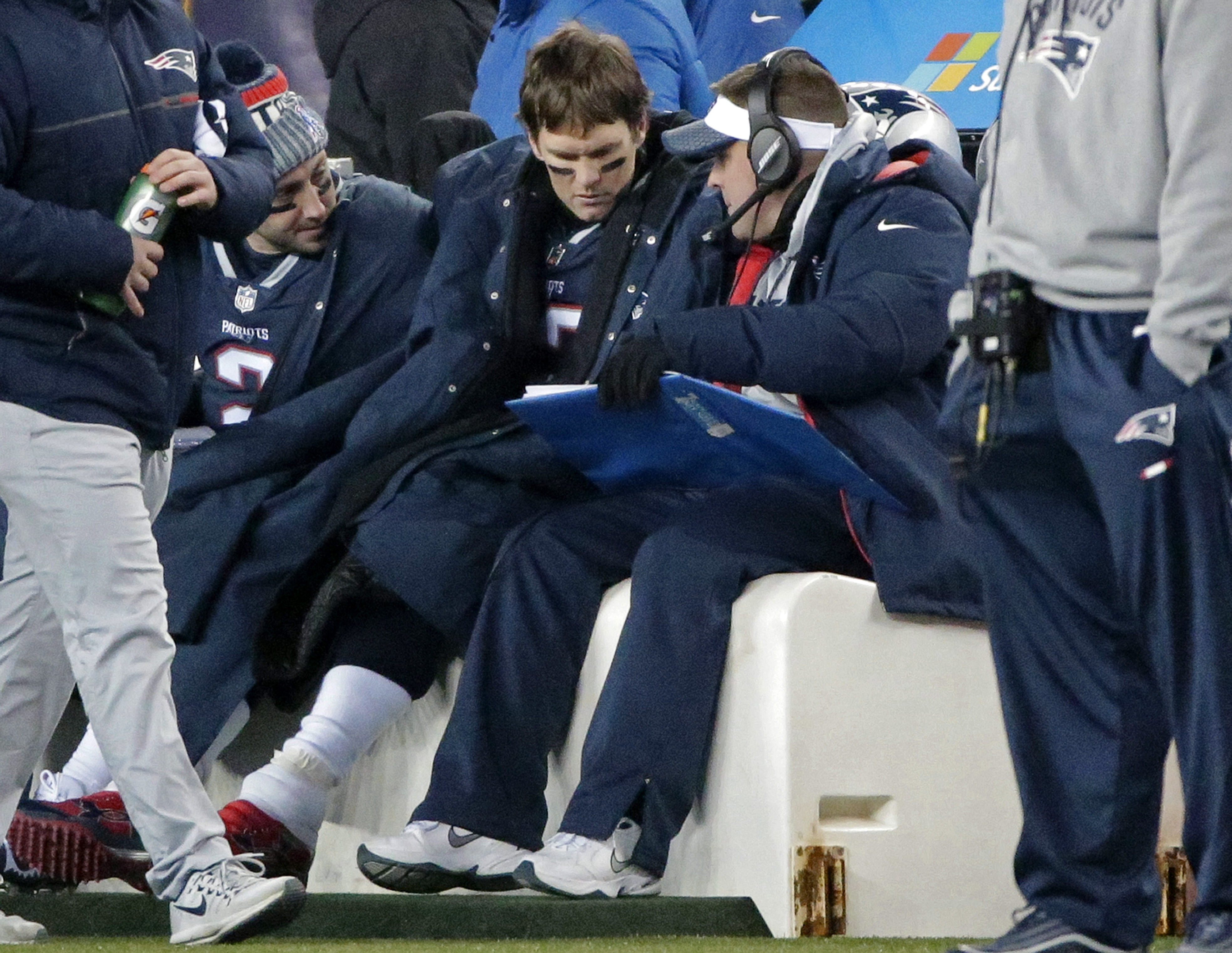 Patriots offensive coordinator Josh McDaniels (right) wears a headset on the sideline, but also gets face time with his quarterback.