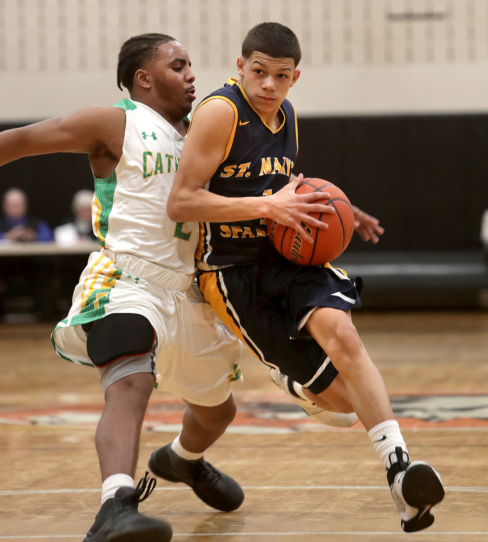A talented point guard on the St. Mary’s boys’ basketball team, Jalen Echevarria (1) said football was the sport he first loved. “At first I was nervous trying a new sport, but it all came back to me,” he said.