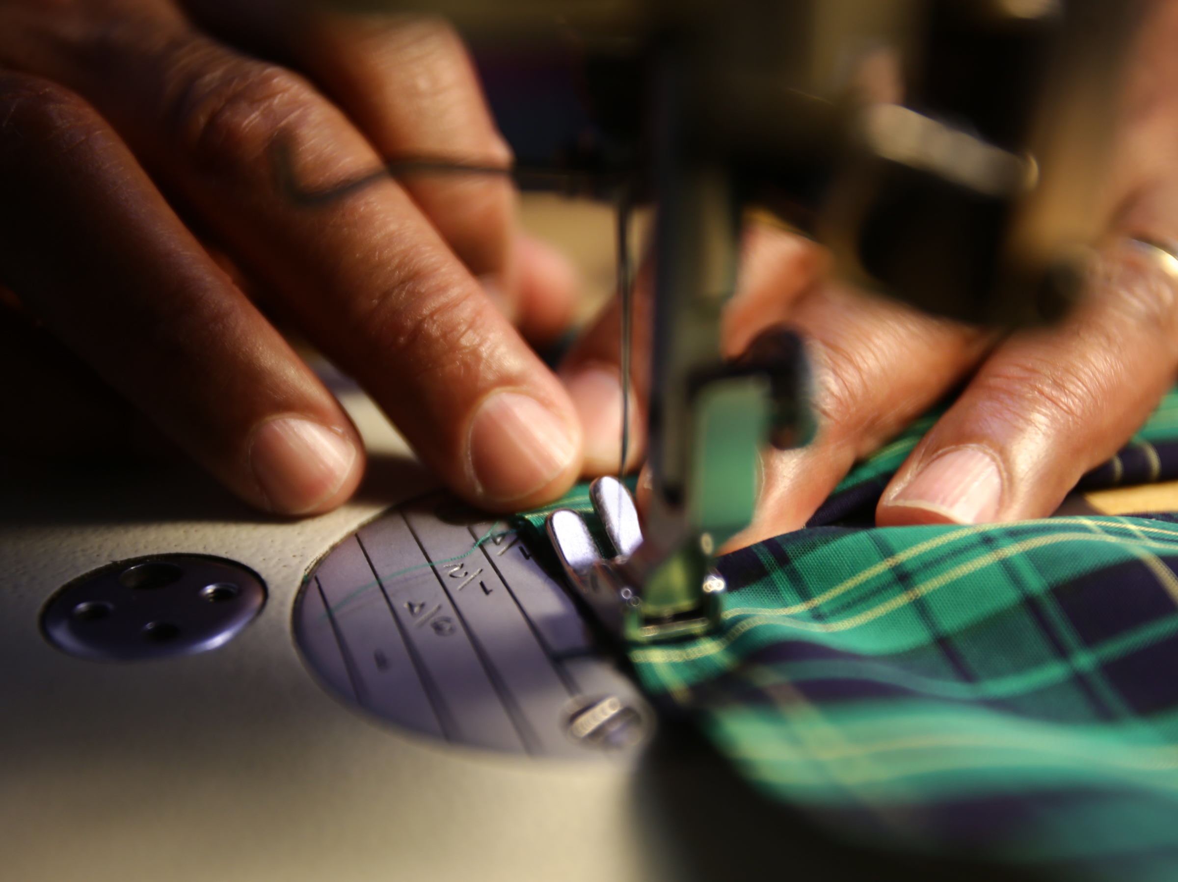 Hinds worked on the cuff of a man's shirt.
