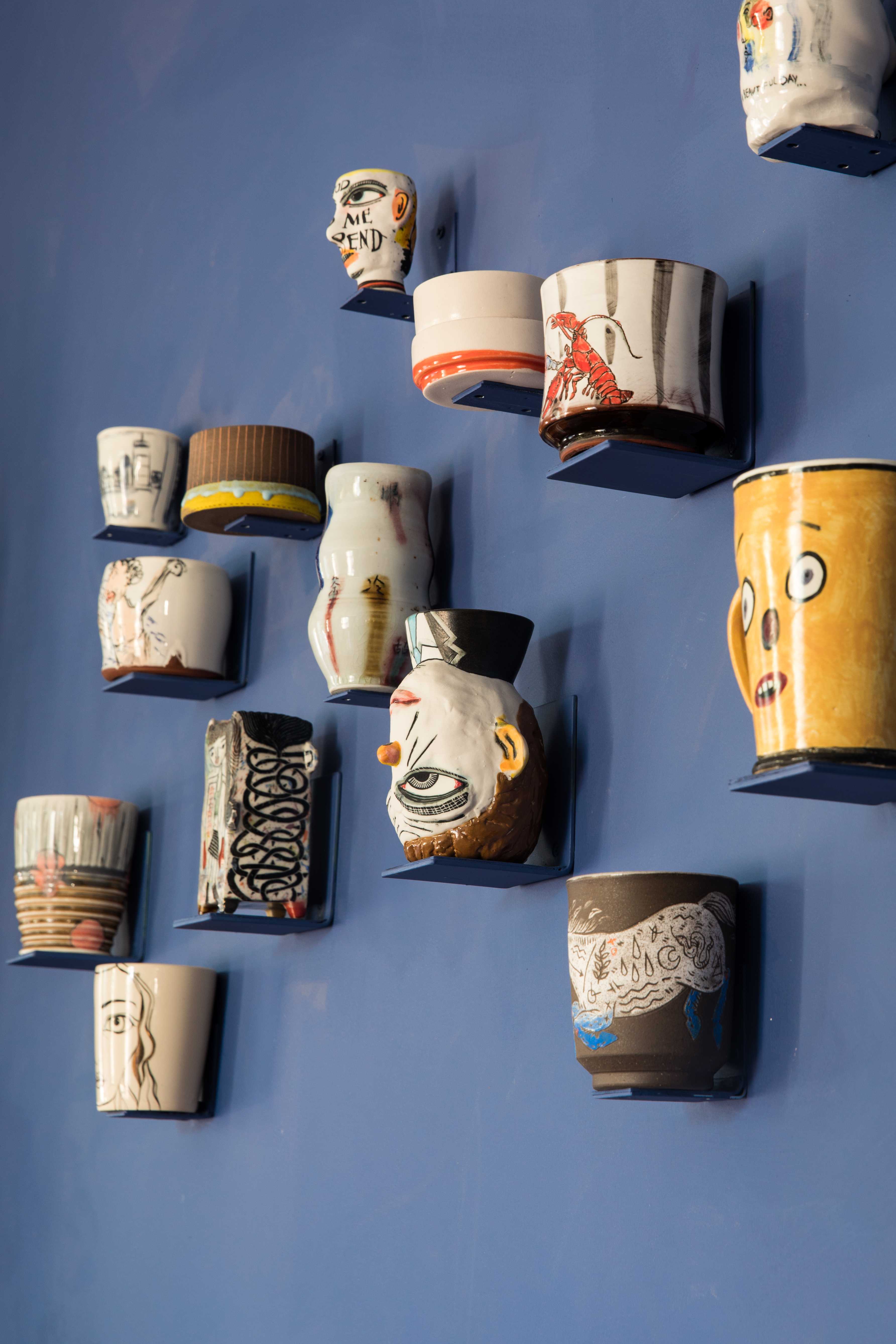 In the dining room, Dewhirst displays some of her many one-of-a-kind ceramic pieces from the Society of Arts + Crafts’ “Our Cups Runneth Over” exhibition.
