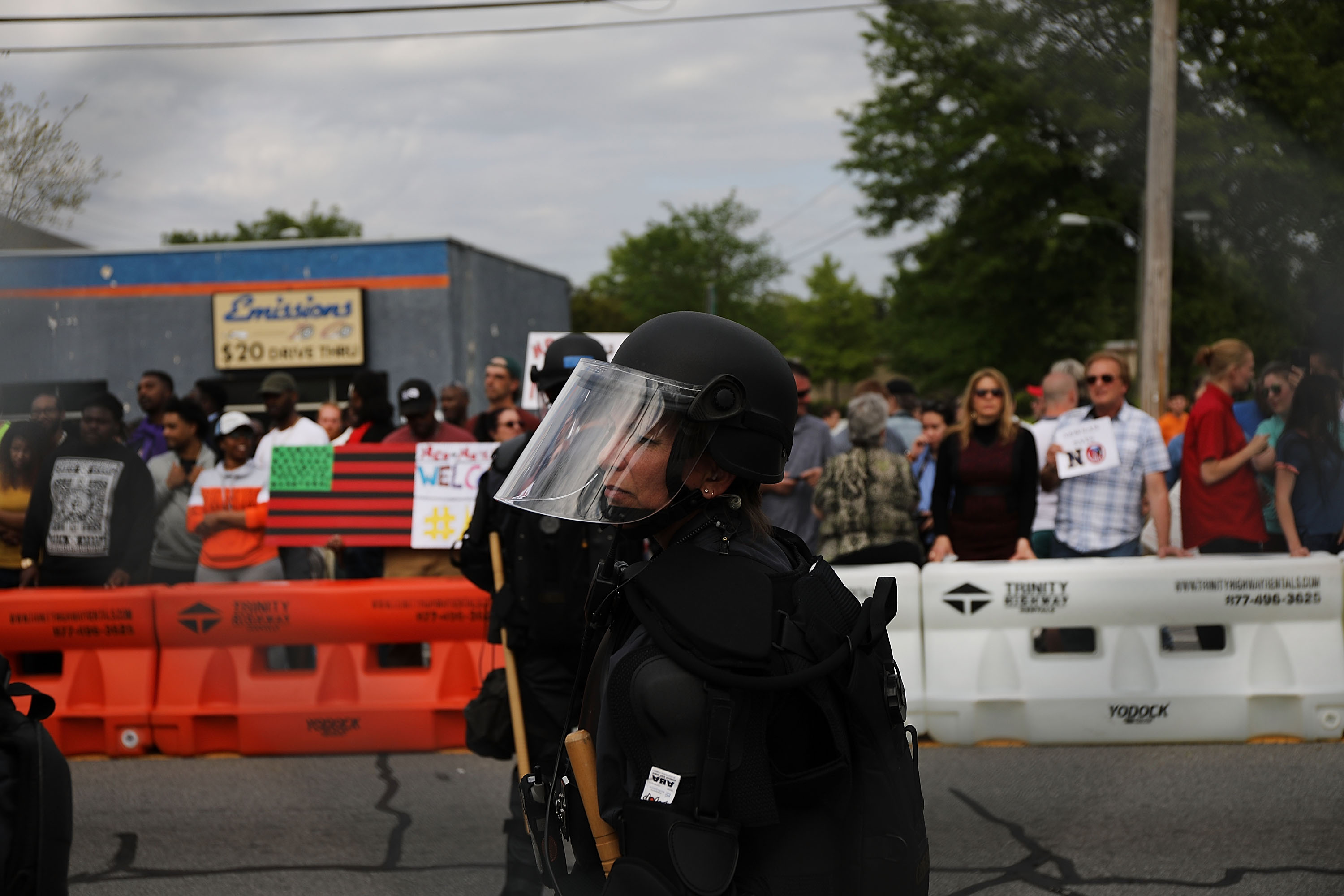 Riot police stood between protesters and members and neo-Nazis during Saturday’s rally.