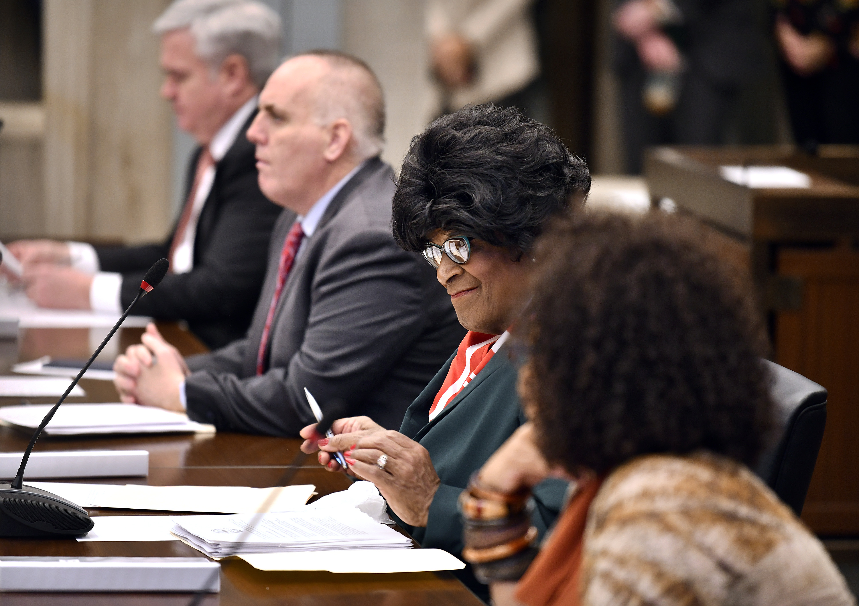 New City Councilor Althea Garrison smiled after taking her seat in the City Council chamber.