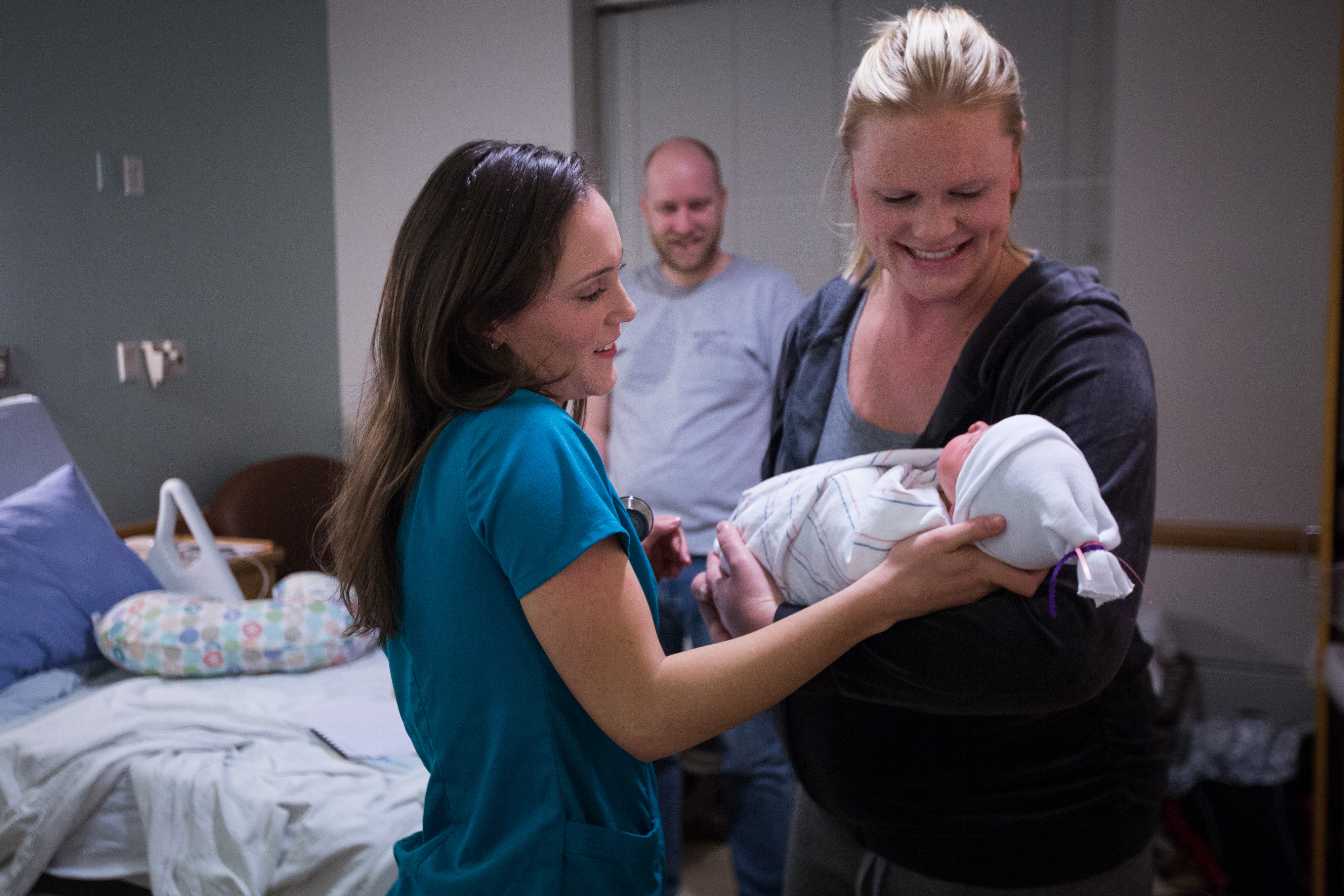 Clinical care Technician Allison DeRizzo gave newborn Ellie Rafeld to her mother Ashlee as she worked in the mother-infant unit.