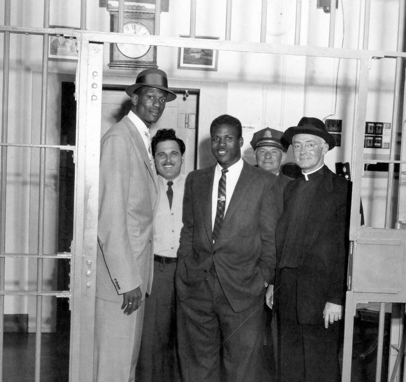 Bill Russell (left) and K.C. Jones were sharply dressed for their visit to Alcatraz, weeks after winning a second NCAA title for San Francisco.