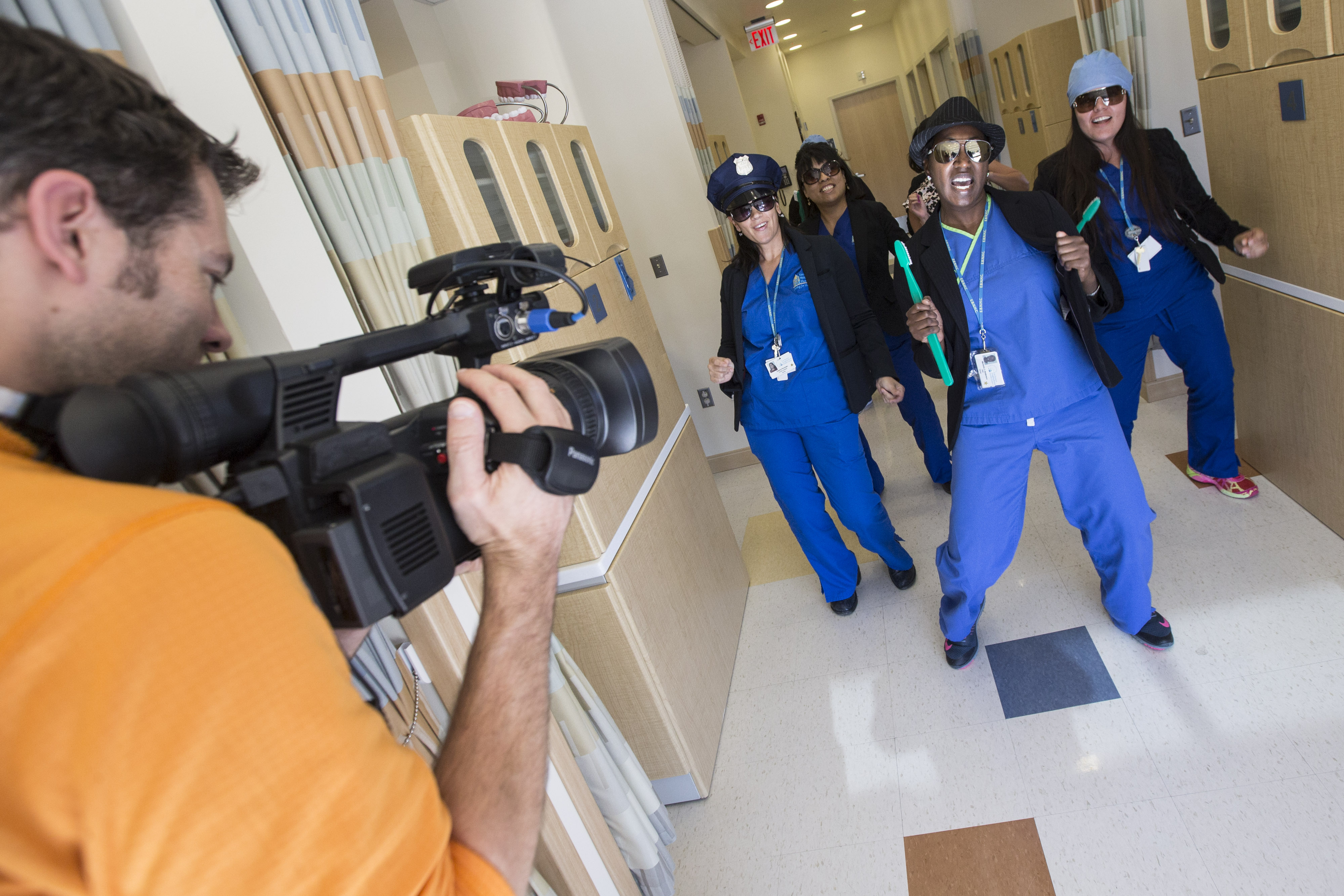 East Boston Neighborhood Health Center employees perform for an upcoming holiday party video.