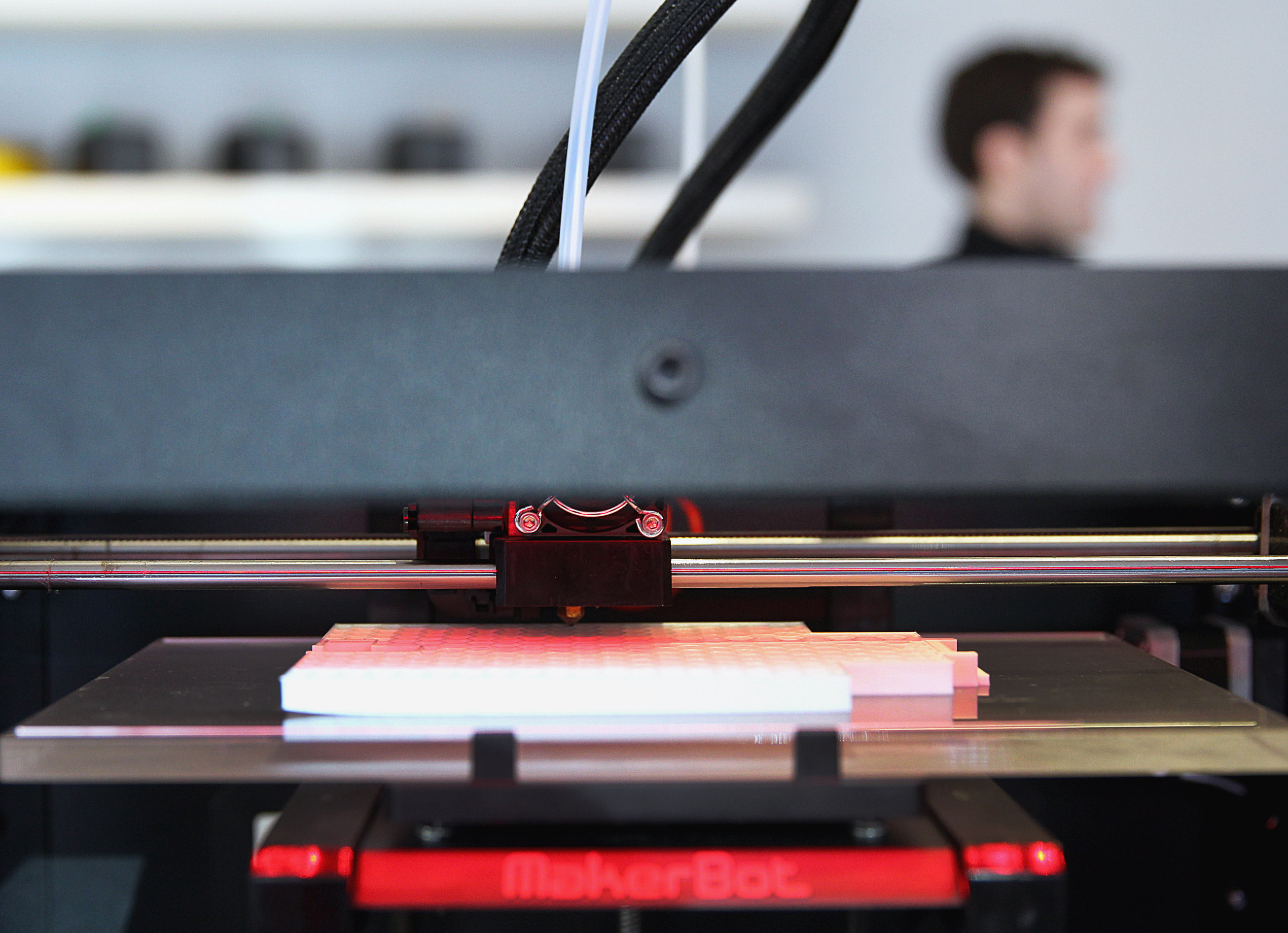 A 3-D printer pumps out tiny dots of plastic to build up layer after layer as it follows a computerized template that is the blueprint for the object that’s being produced.