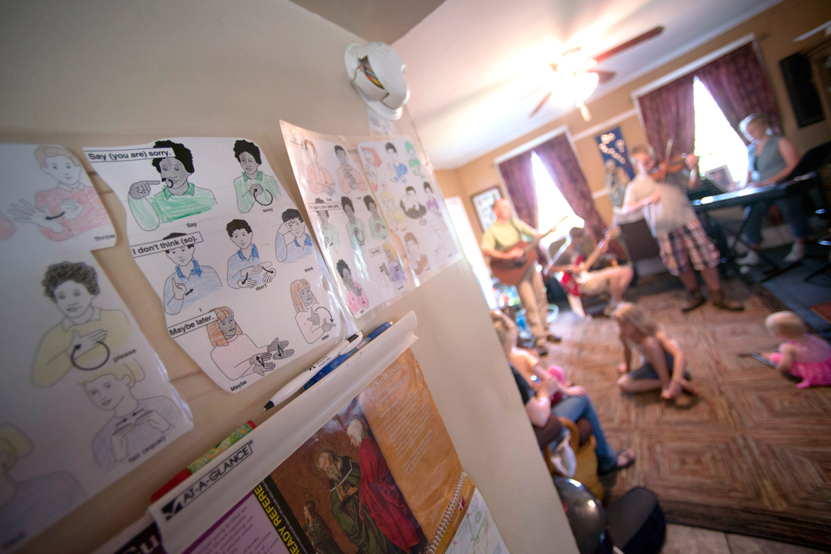 Sign language charts at the home of Jeanne and Andy Nadeau, who are preparing should their five children who suffer from hearing loss eventually become deaf.