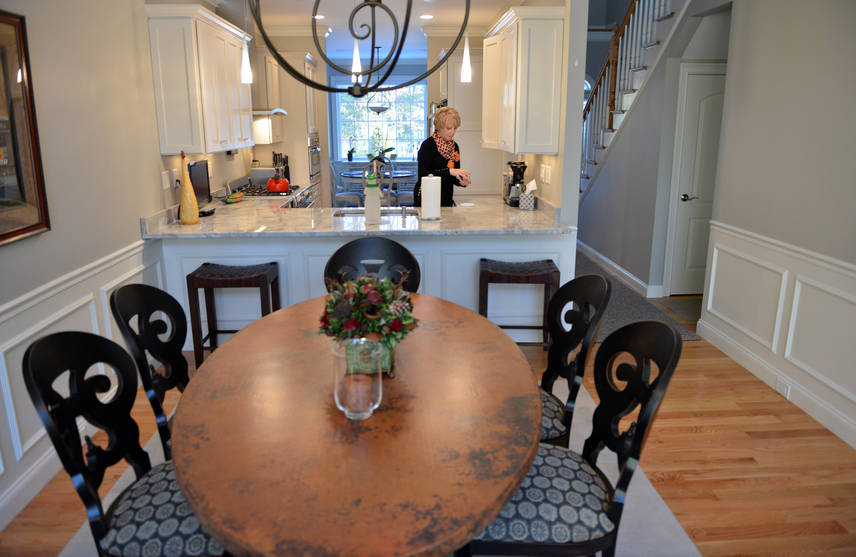 Pam Birmingham lives in Lynnfield’s Windsor Estates. The community doesn’t have a pool, but emphasizes elegance.