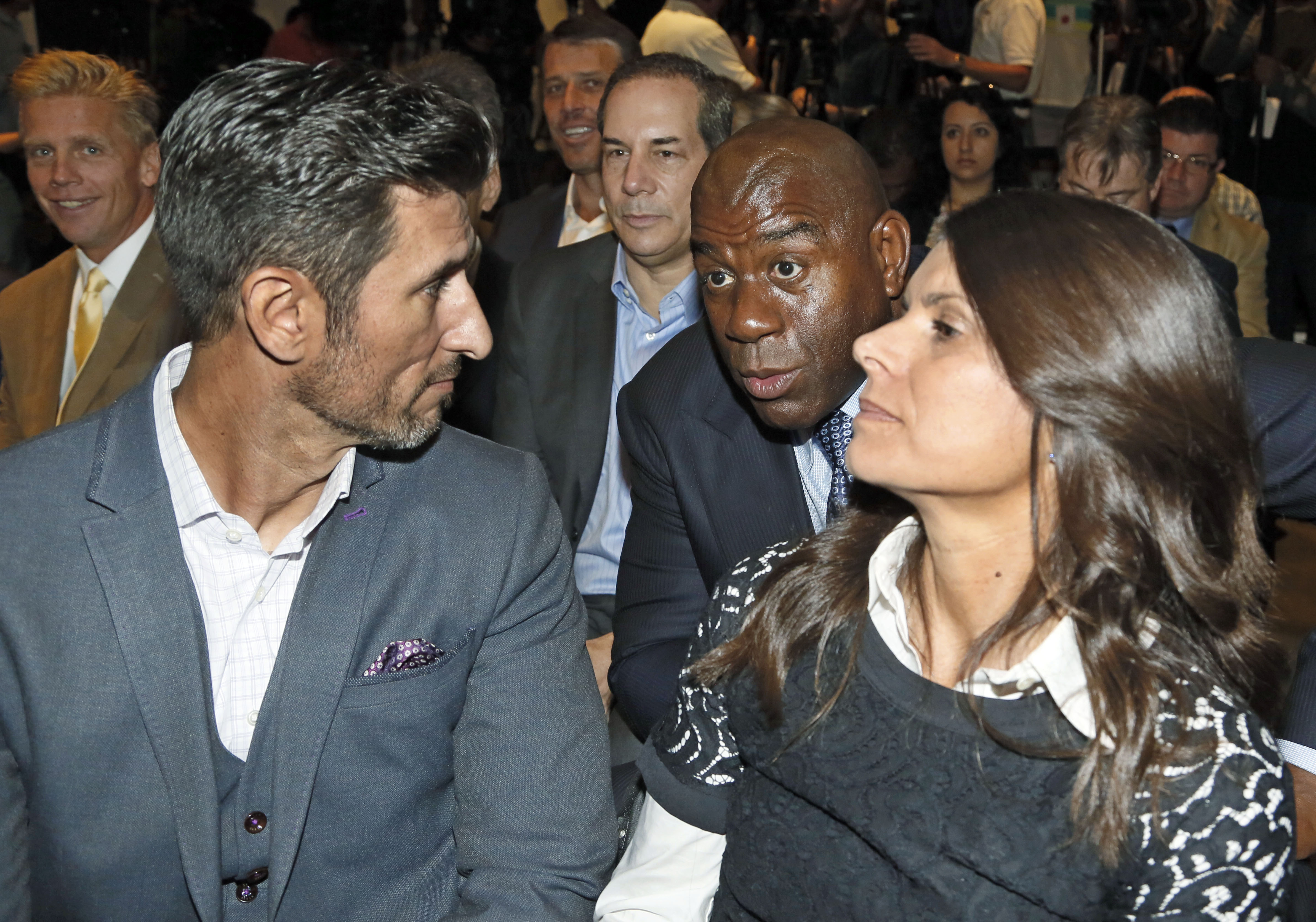 Mia Hamm (right), Magic Johnson (center), and Nomar Garciaparra (left) at a news conference on Oct. 30 in Los Angeles.