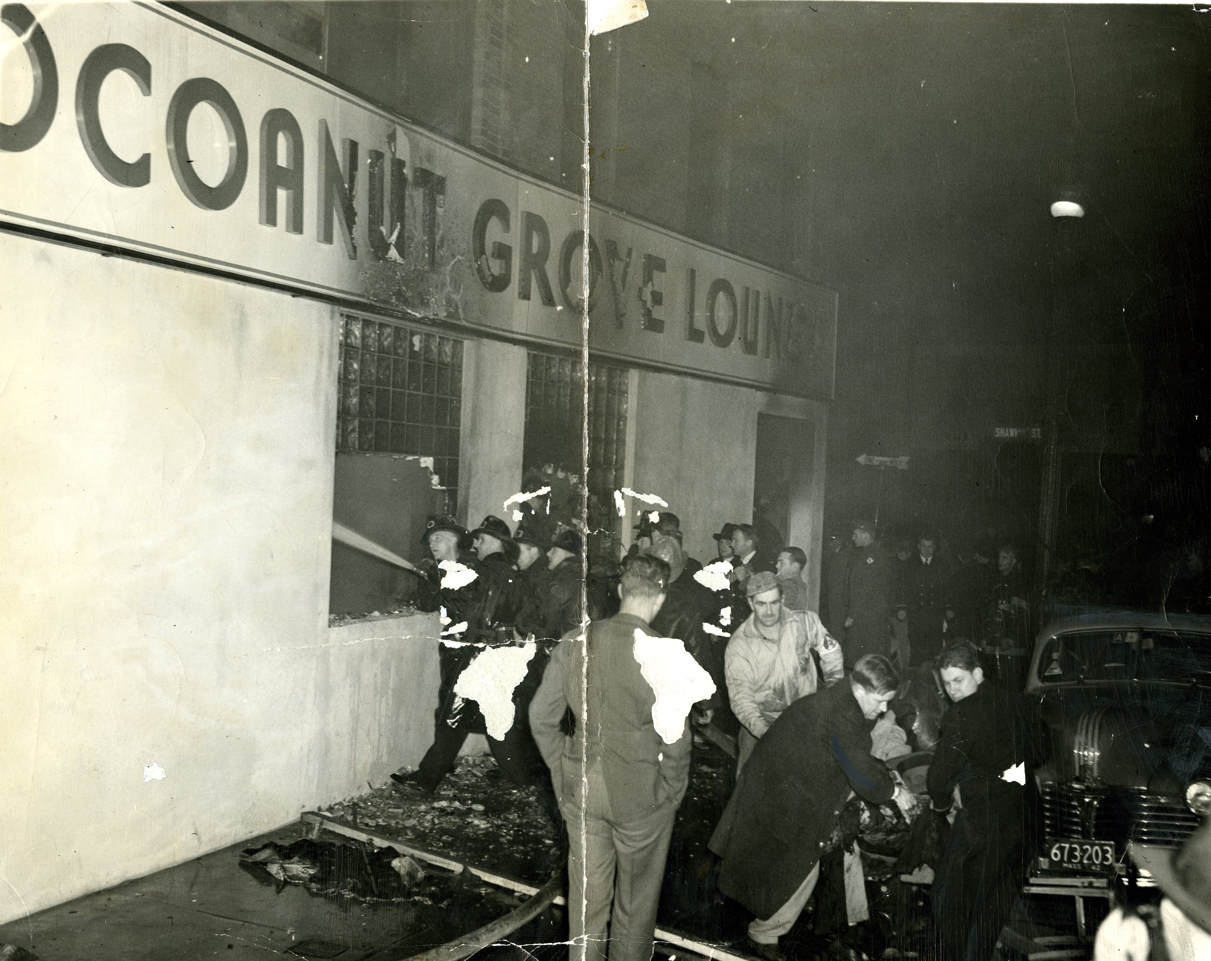 Firemen streamed water into the Cocoanut Grove Lounge through the windows.
