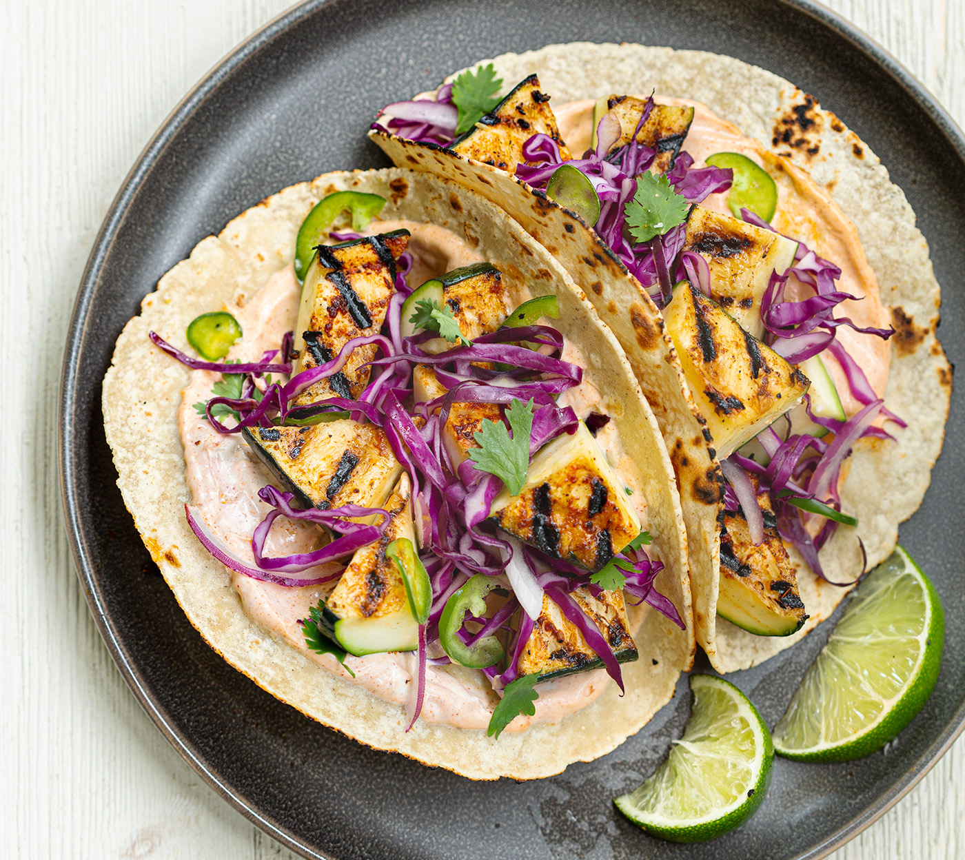 Grilled zucchini tacos with cabbage slaw and chipotle crema.