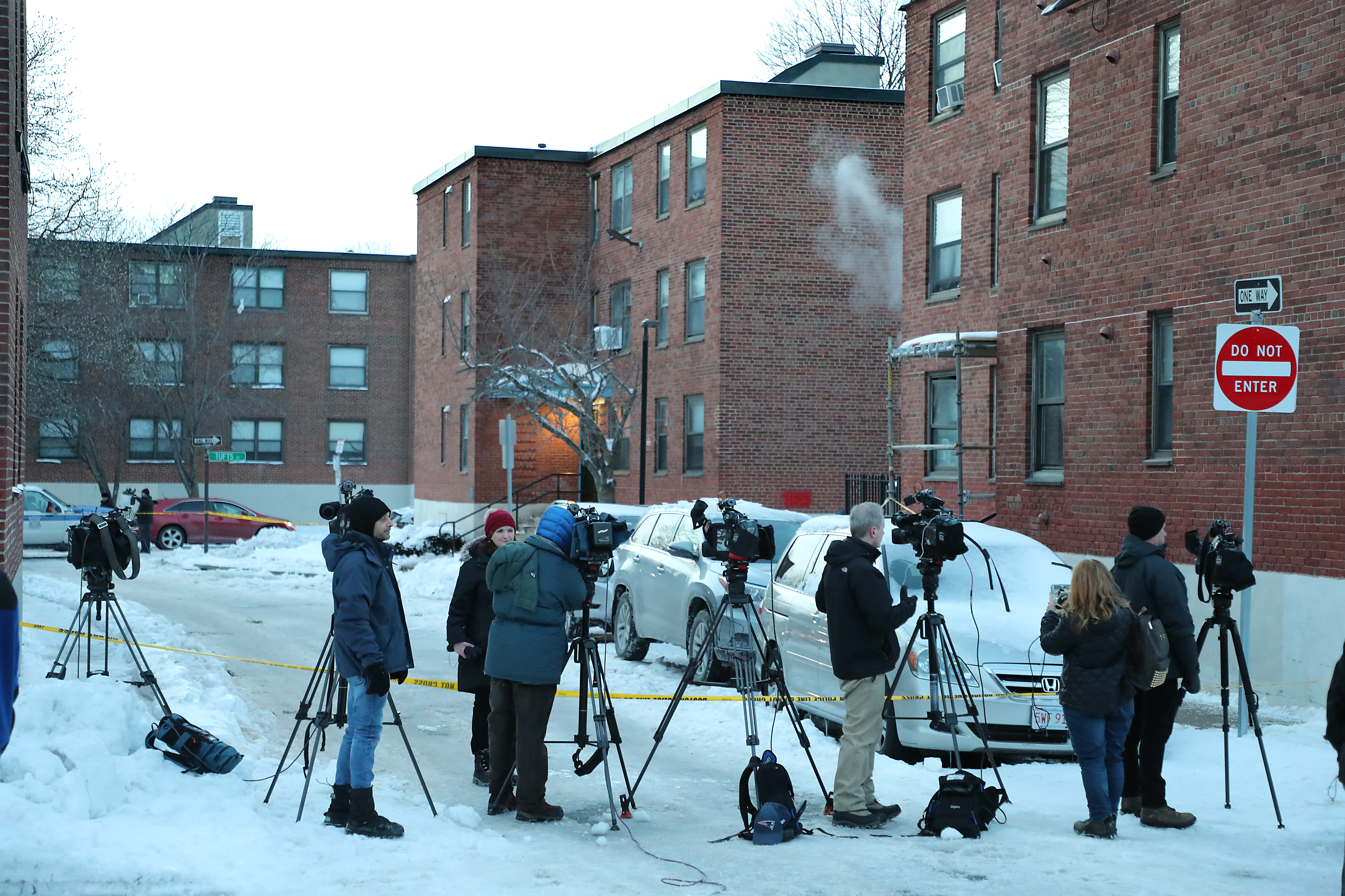 Media members were at the housing complex where Boston police arrested Victor Pena.