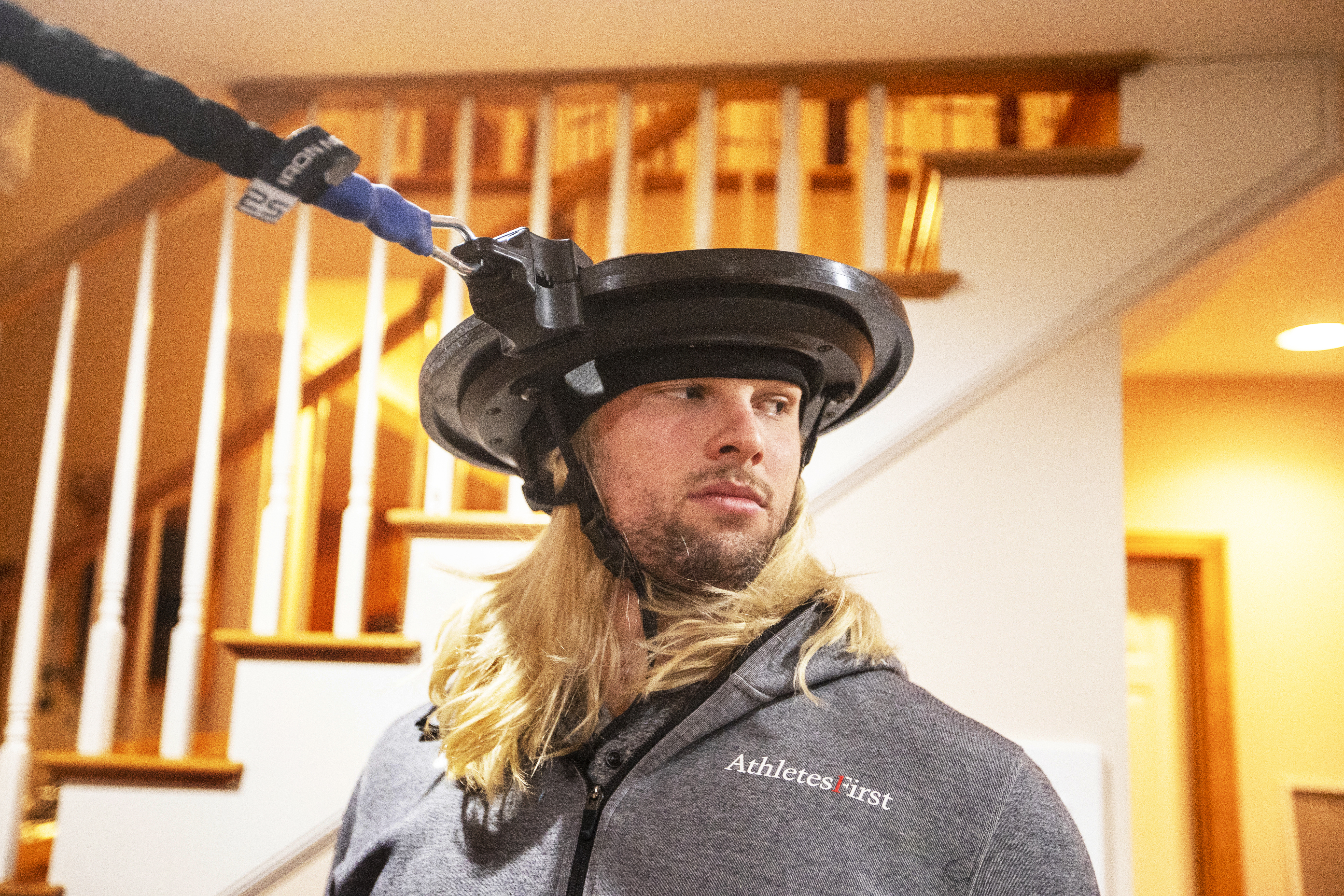 Winovich uses an Iron Neck device to build up his neck muscles.