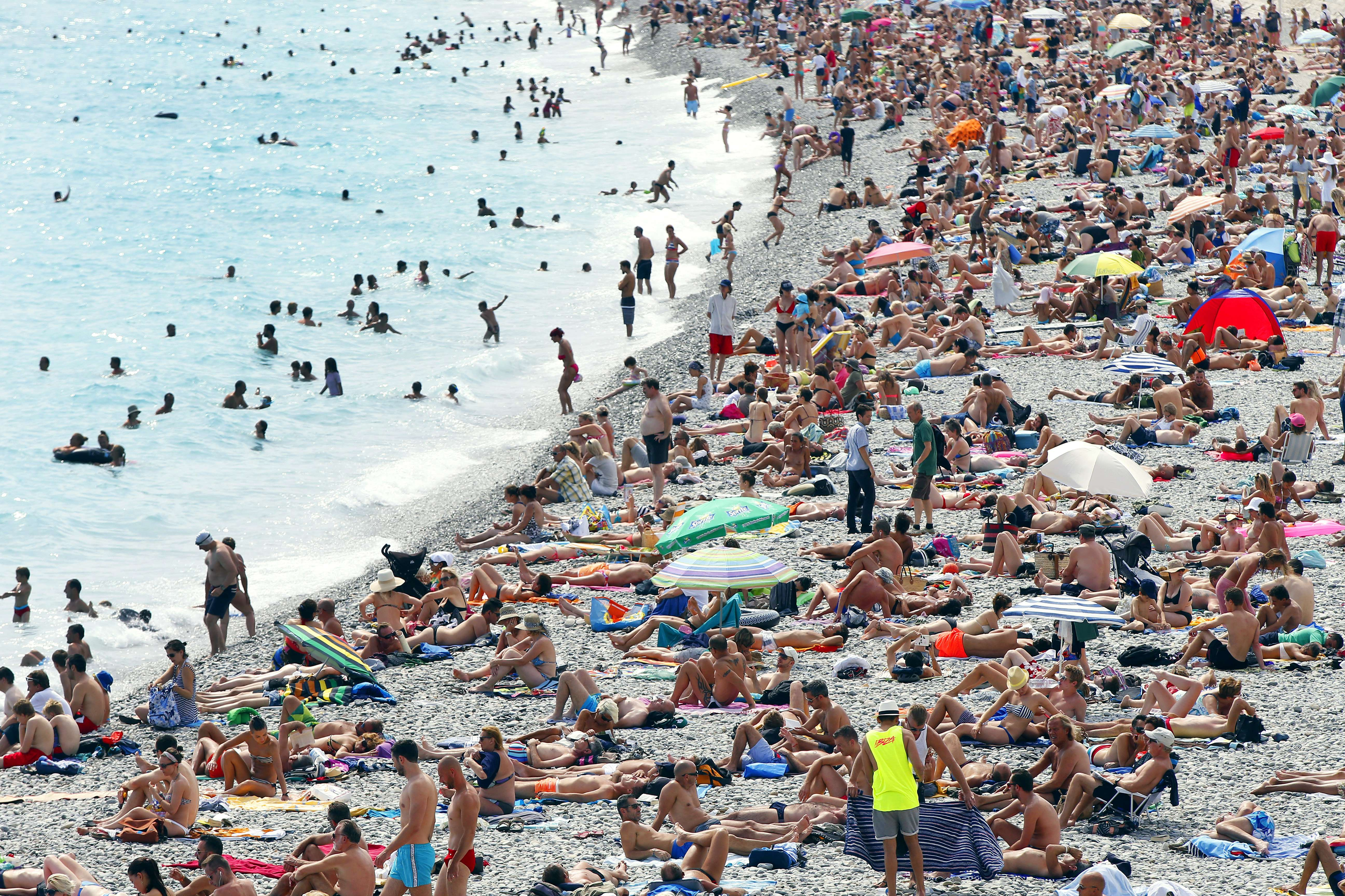 Sunbathers relaxed on the French Riviera in Nice last month. France mandates 30 paid vacation days per year.