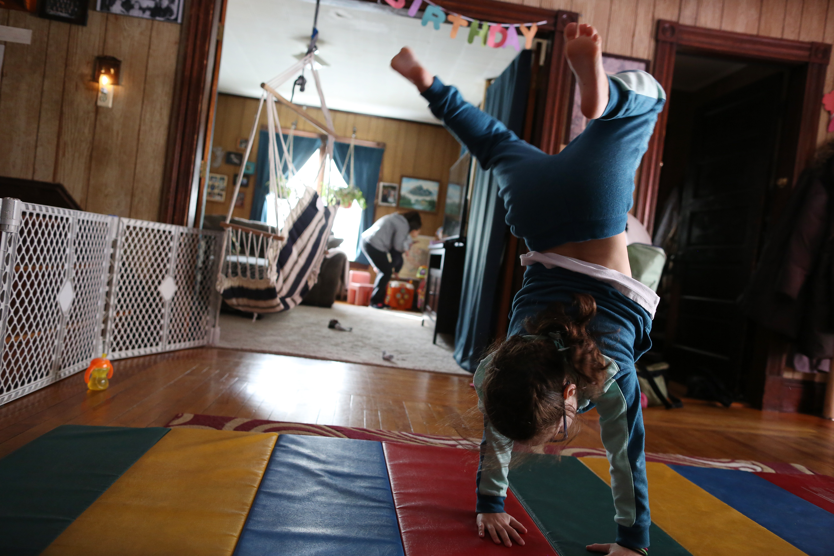 Suzor’s daughter Joley turned cartwheels as Suzor tended to a 16-month-old foster child.