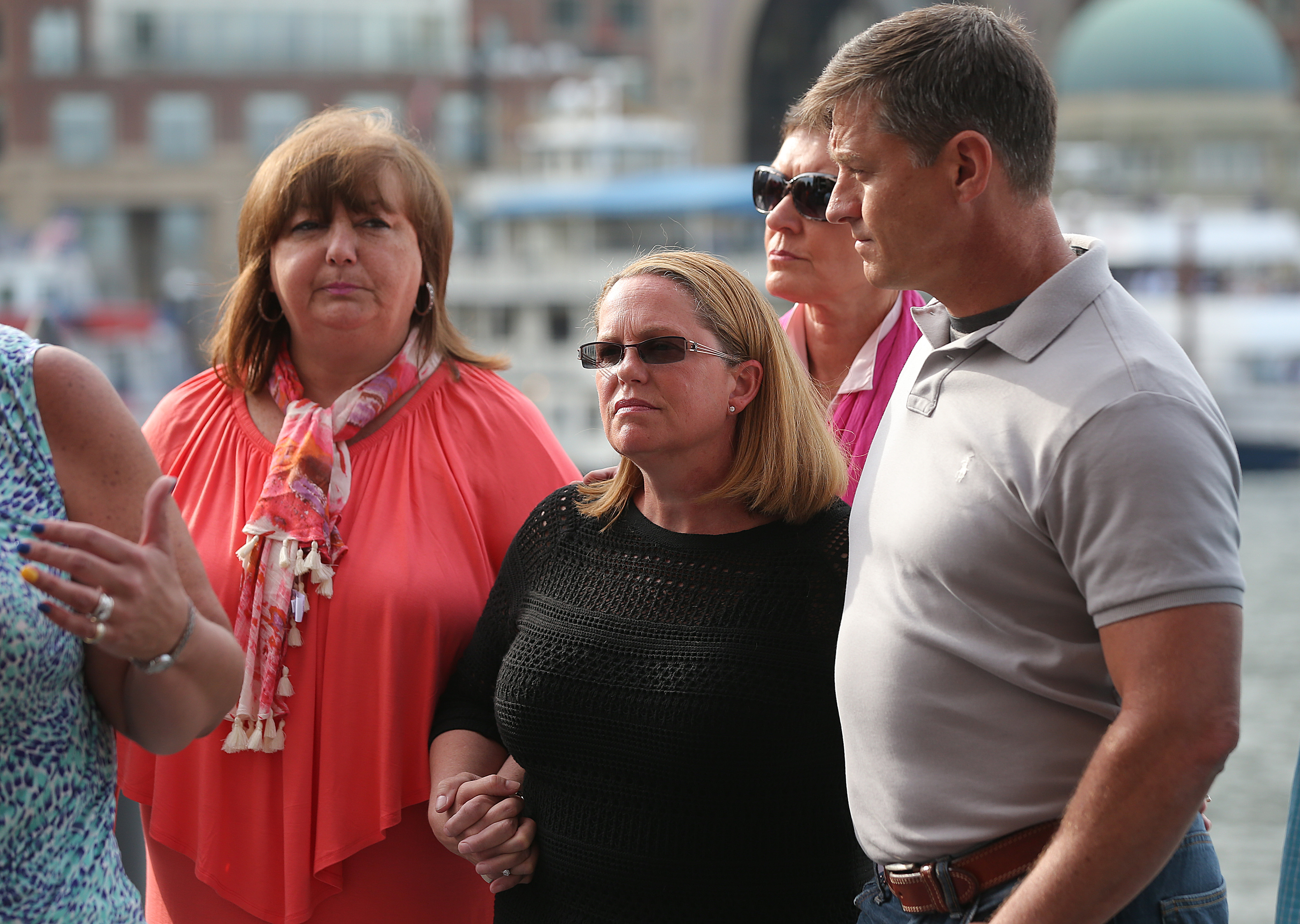 Liz Norden (left), Jean Marie Parker, Laurie Scher and first responder Mike Ward listened to Karen Brassard speaking to the media about the death sentence for Dzhokhar Tsarnaev.