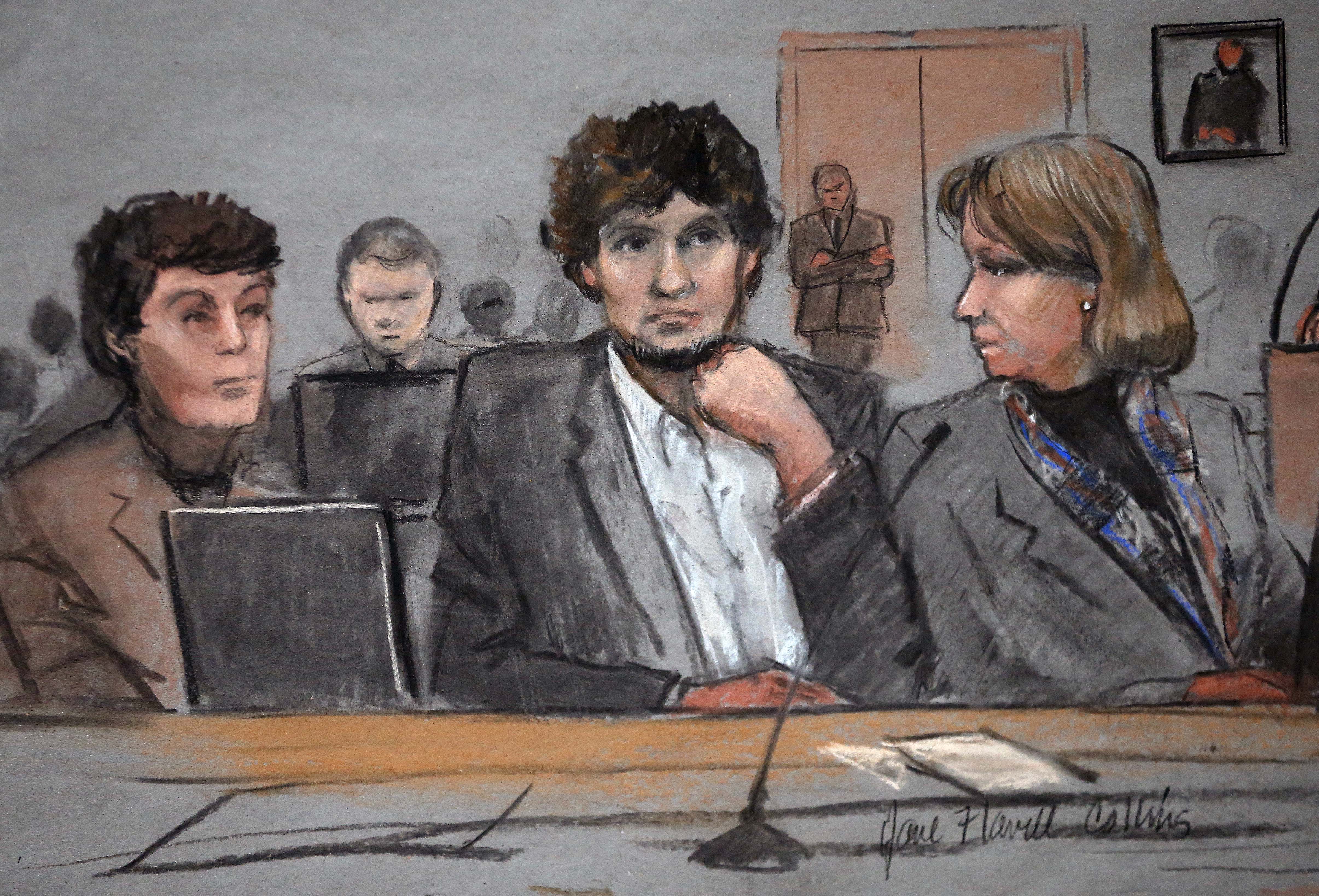 Dzhokhar Tsarnaev (center) is depicted in a courtroom sketch between defense attorneys Miriam Conrad (left) and Judy Clarke.