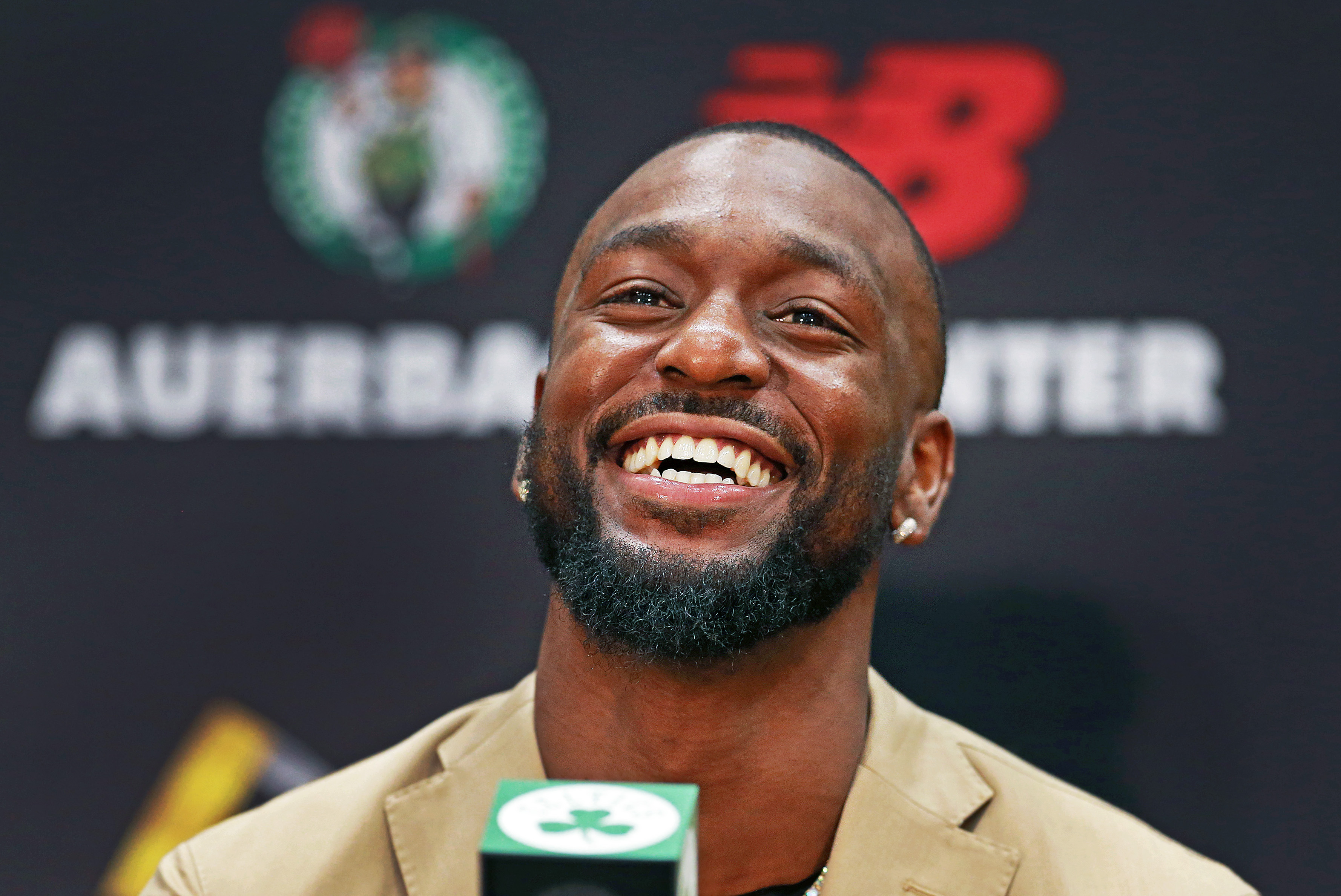 Kemba Walker smiles at an introductory press conference with the Celtics. For Danny Ainge, signing Walker was a no-brainer.