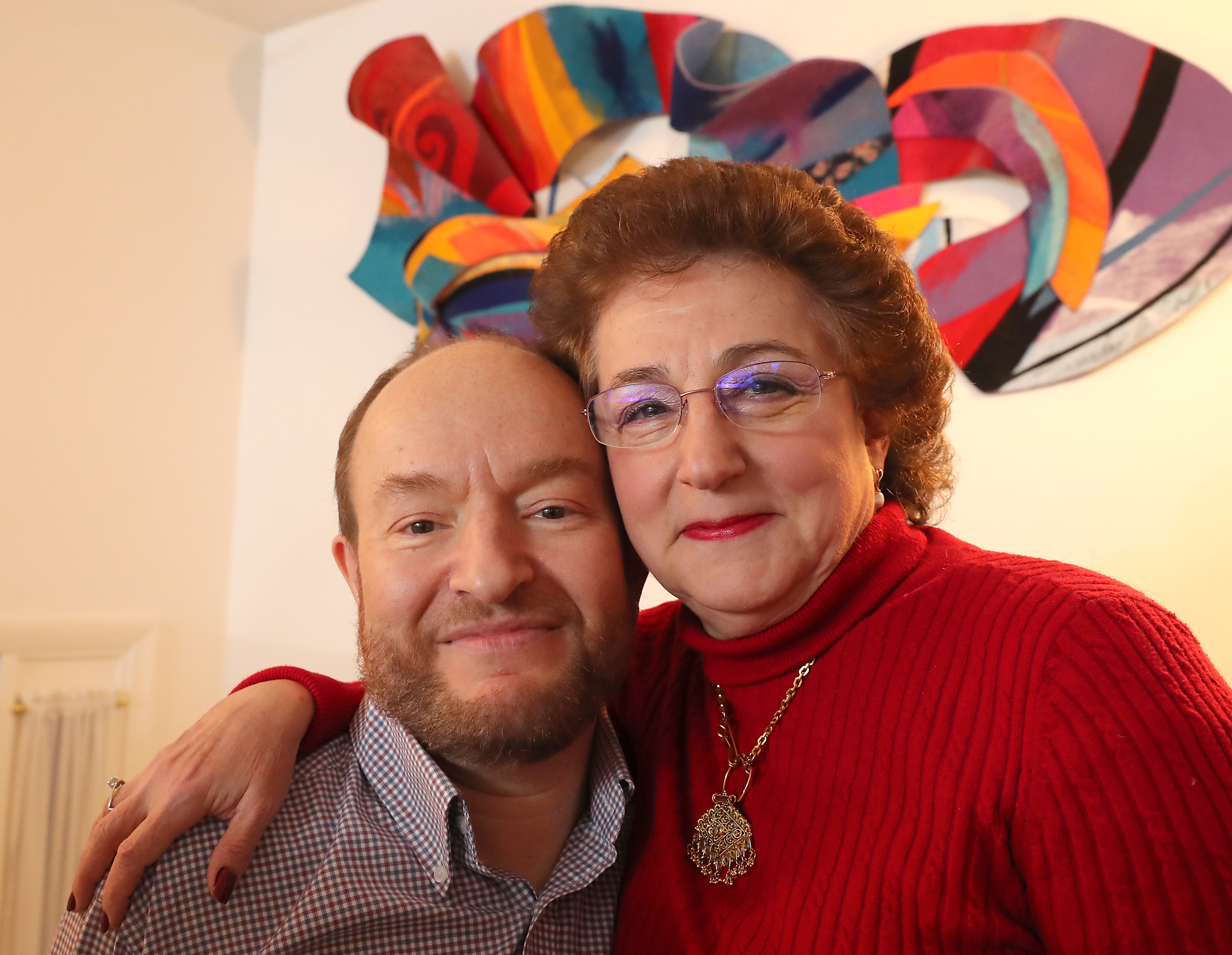 Terry Furman with his wife, Judith Swack, in their living room.