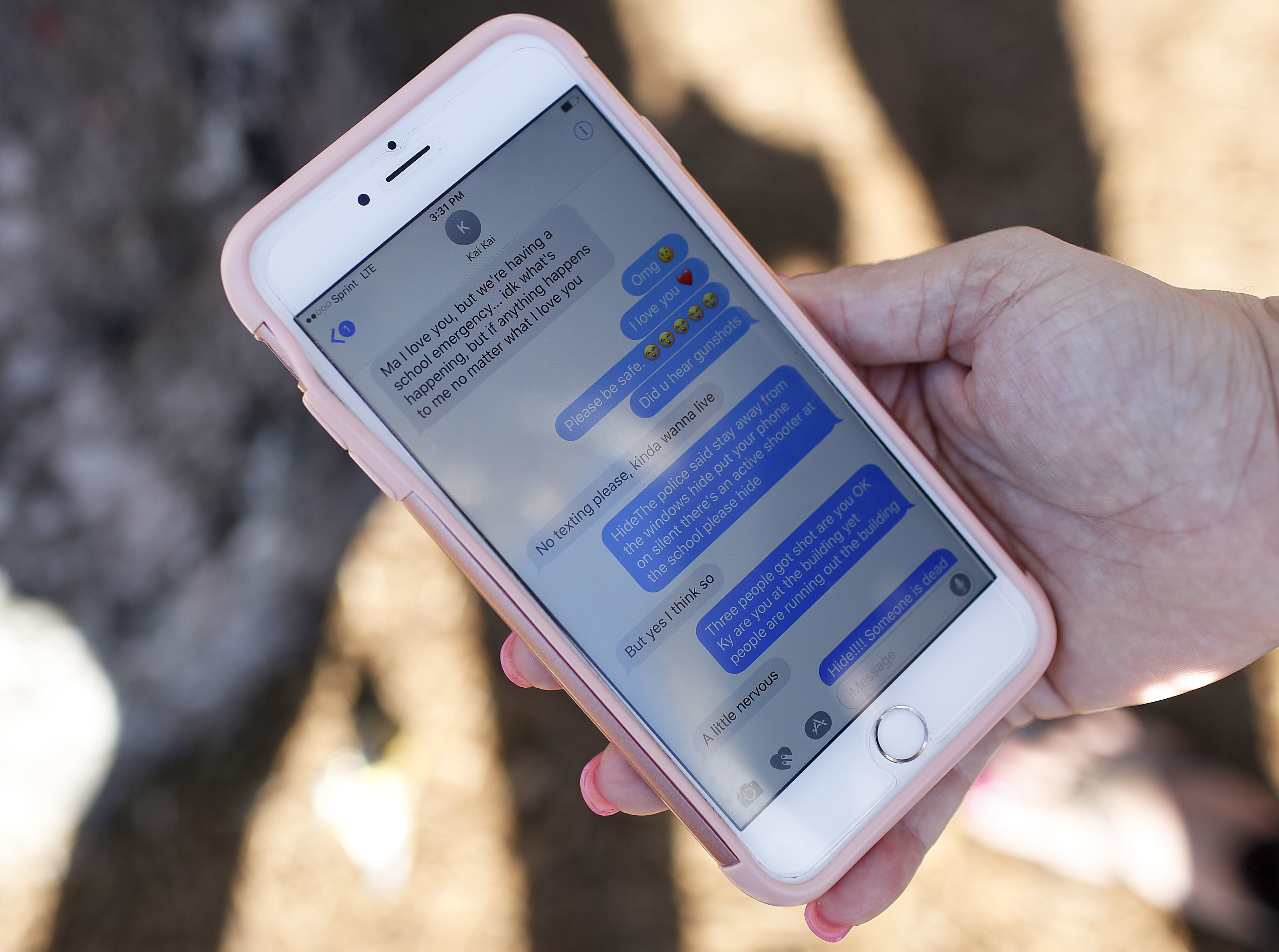 Alana Koer, 41, of Parkland, Fla., shows text messages she received from her son the day before.