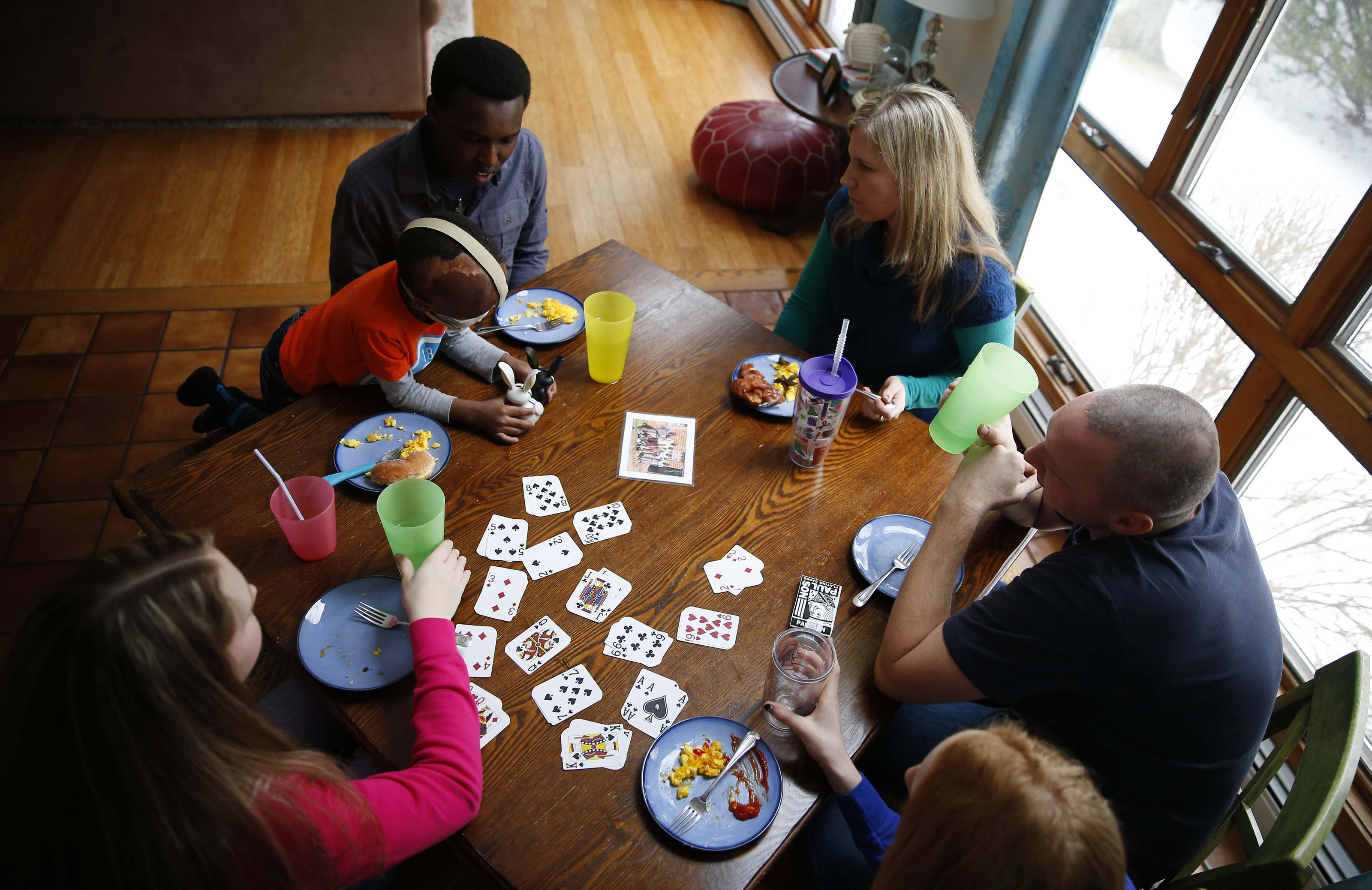 Nate Criser (at right) and his family opened their West Yarmouth home to Leo and Alex after a chance meeting.