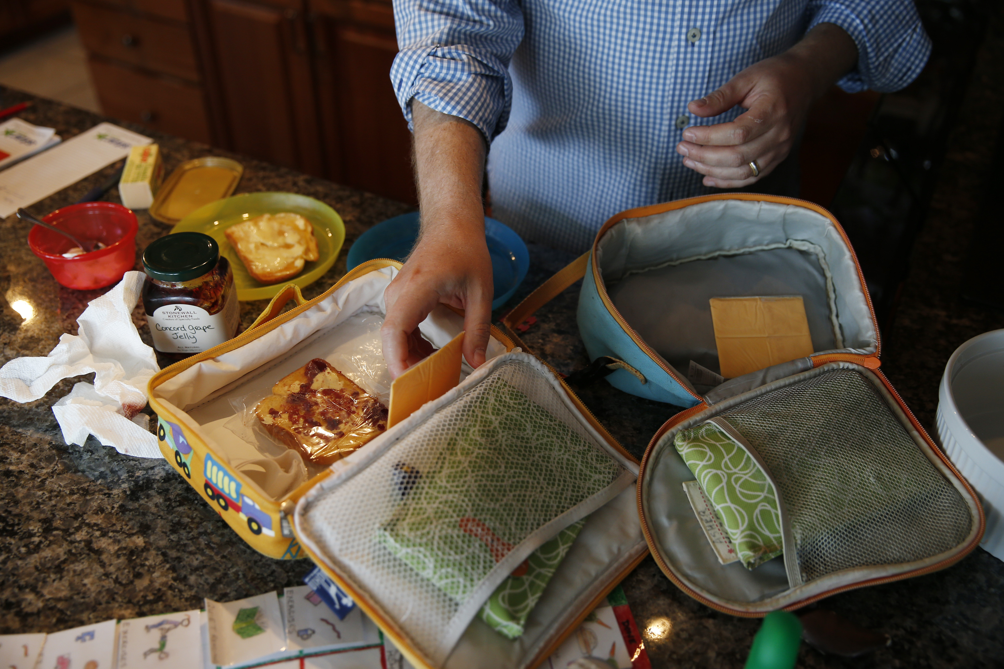 <b>7:44 a.m.</b> Mezrich packs snacks for his kids to take to school.