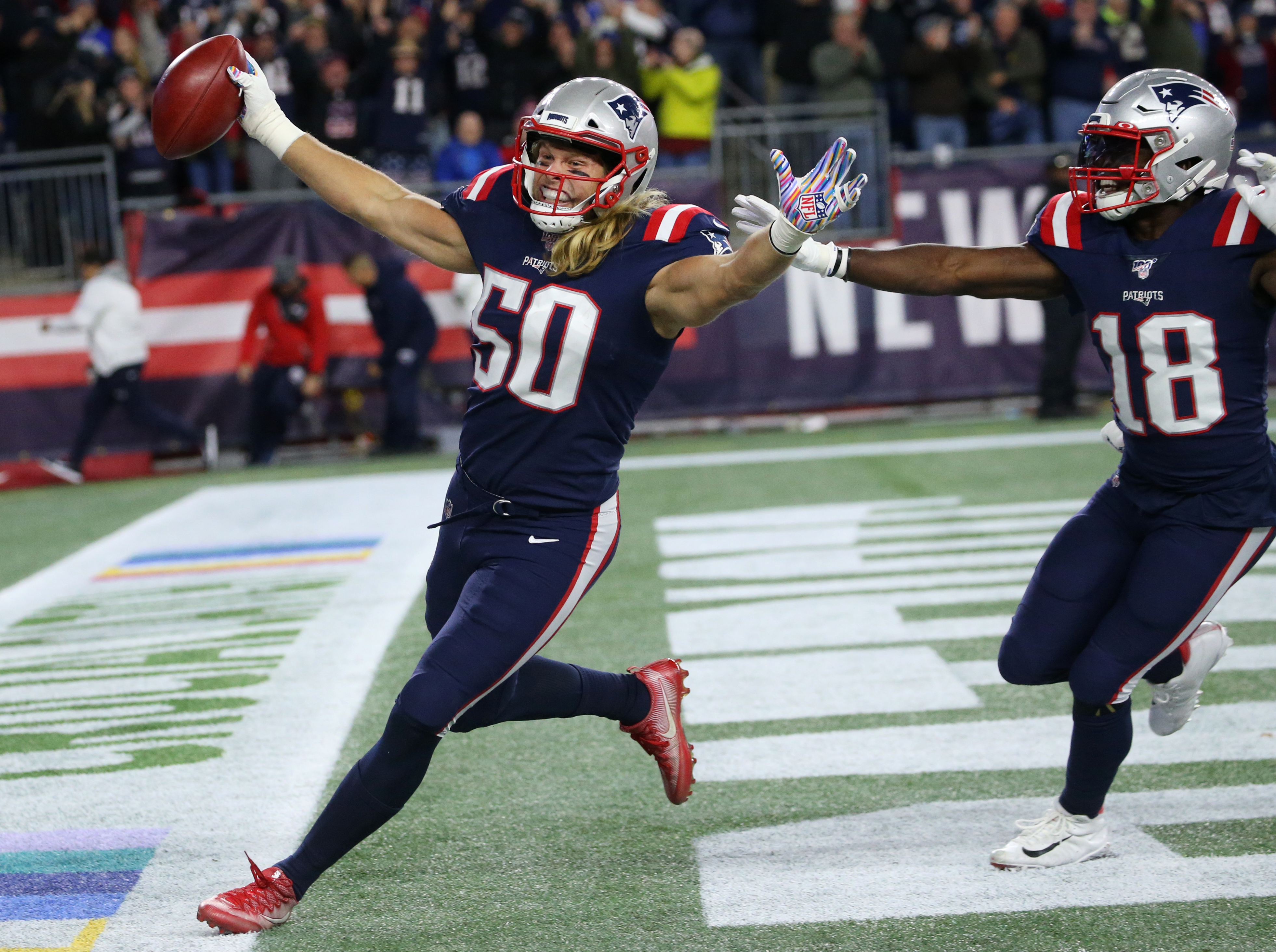 Chase Winovich’s touchdown on a blocked punt was aided by Brandon Bolden (not pictured).