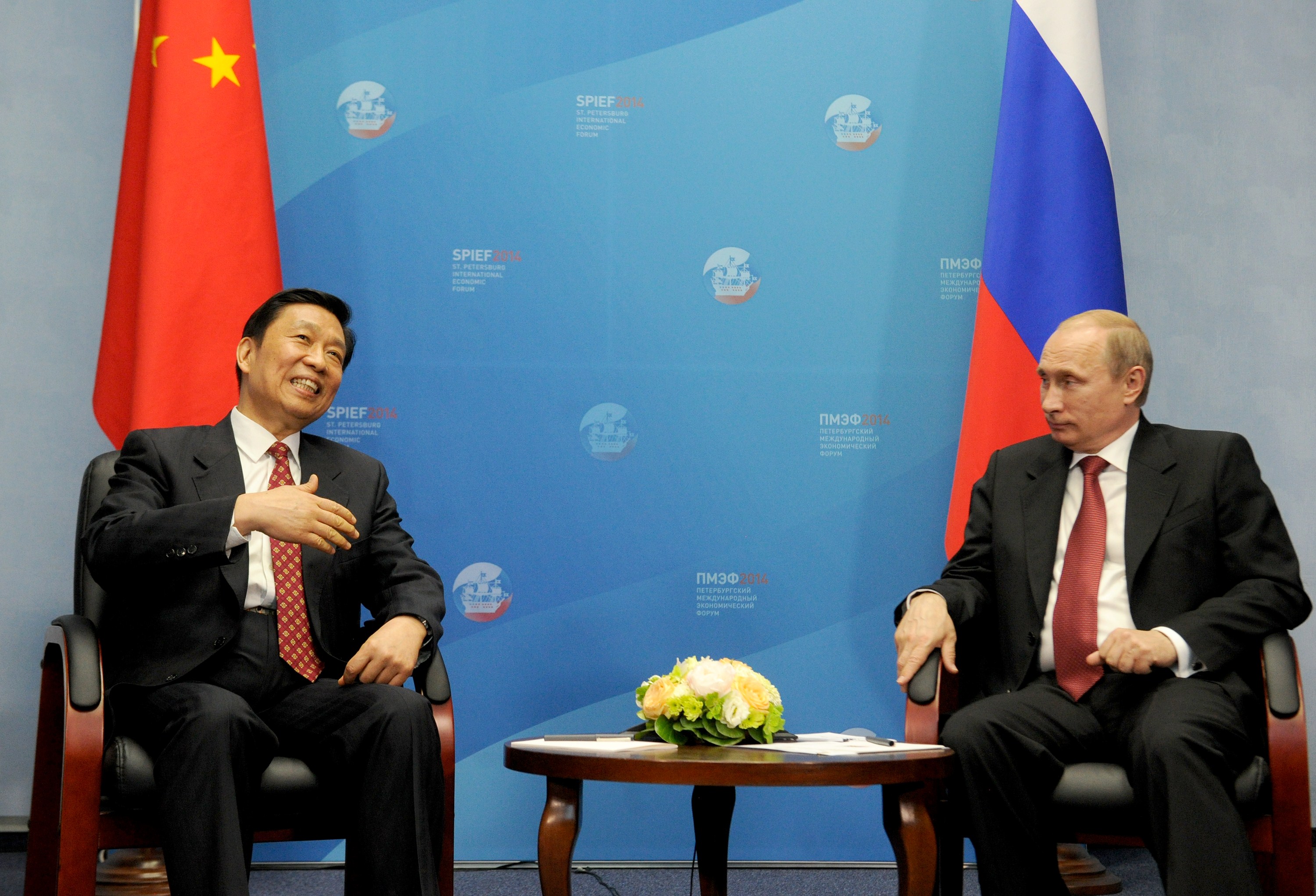 Chinese Vice President Li Yuanchao (left) met with Russia’s President Vladimir Putin in a bilateral meeting on the sidelines of an economic forum in Saint Petersburg in May.