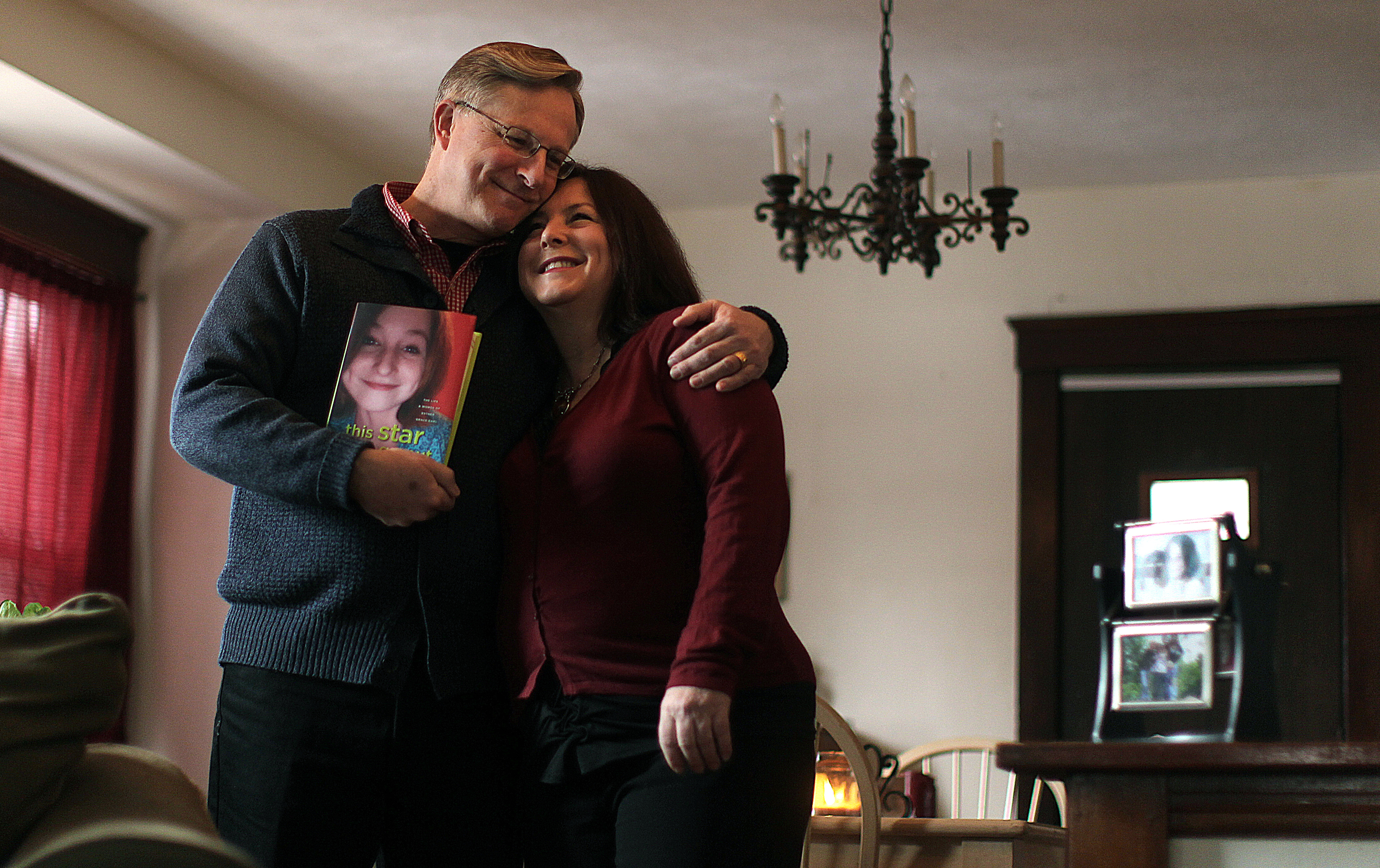Wayne and Lori Earl in the dining room of their Quincy home, which became Esther’s bedroom while she was very ill.