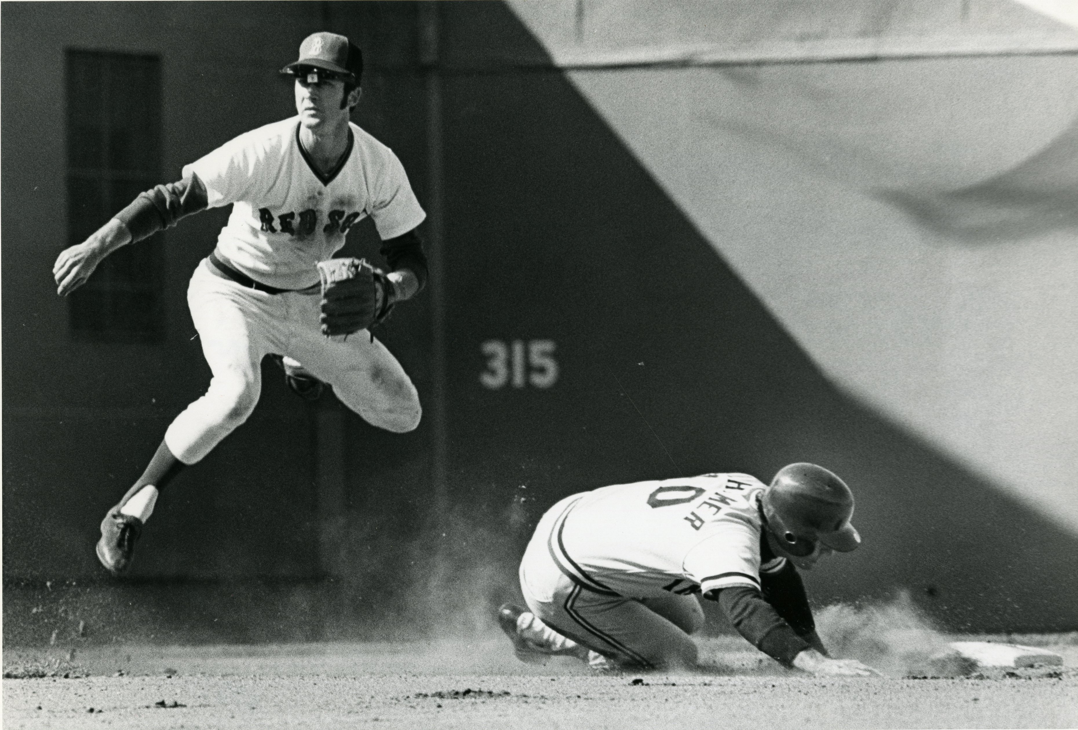 Red Sox infielder Doug Griffin turns a double play in the 6th inning against the Indians at Fenway Park on April 20, 1974.