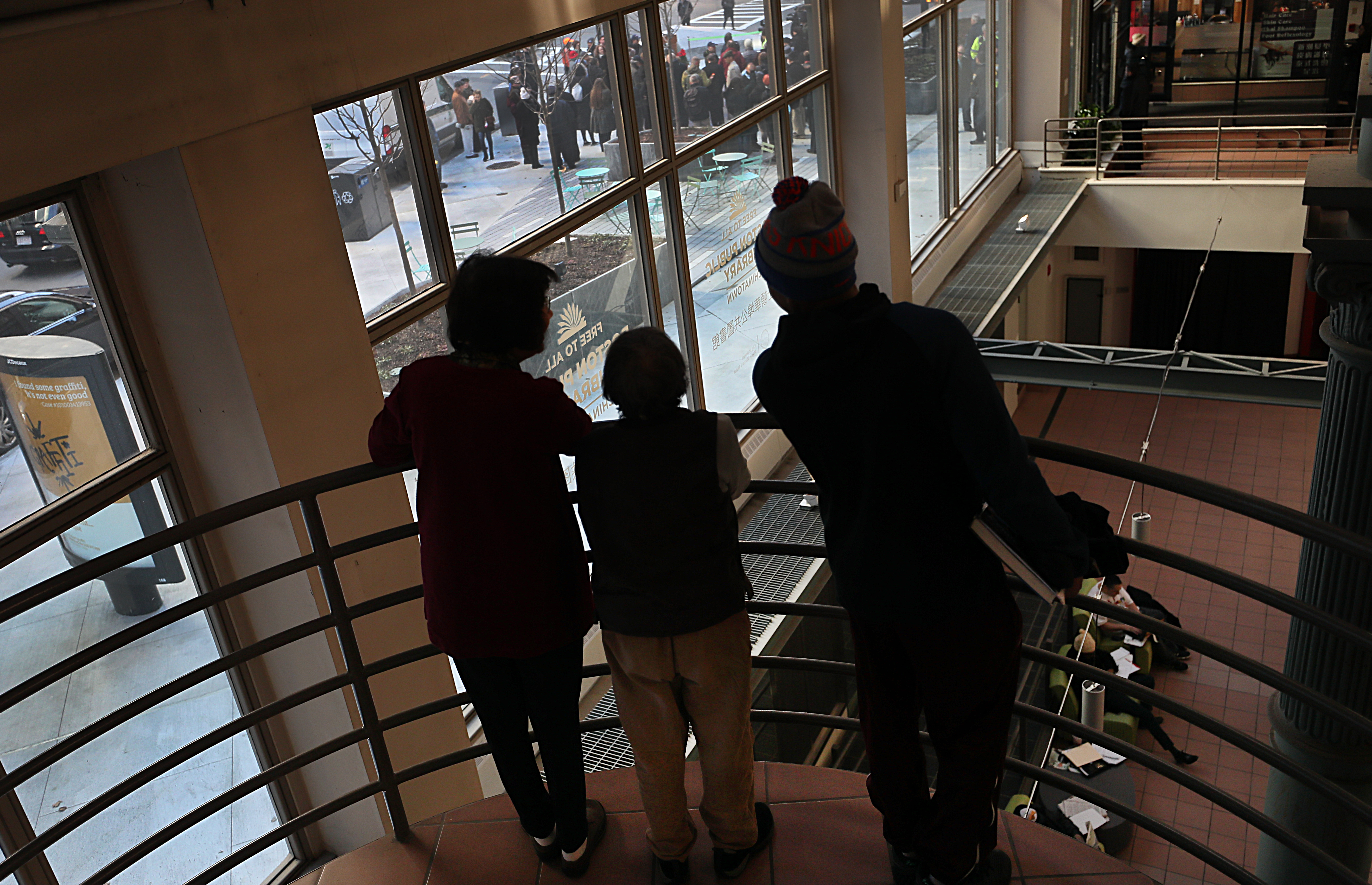 People inside the China Trade Center watched the dedication ceremony of Liberty Tree Plaza.